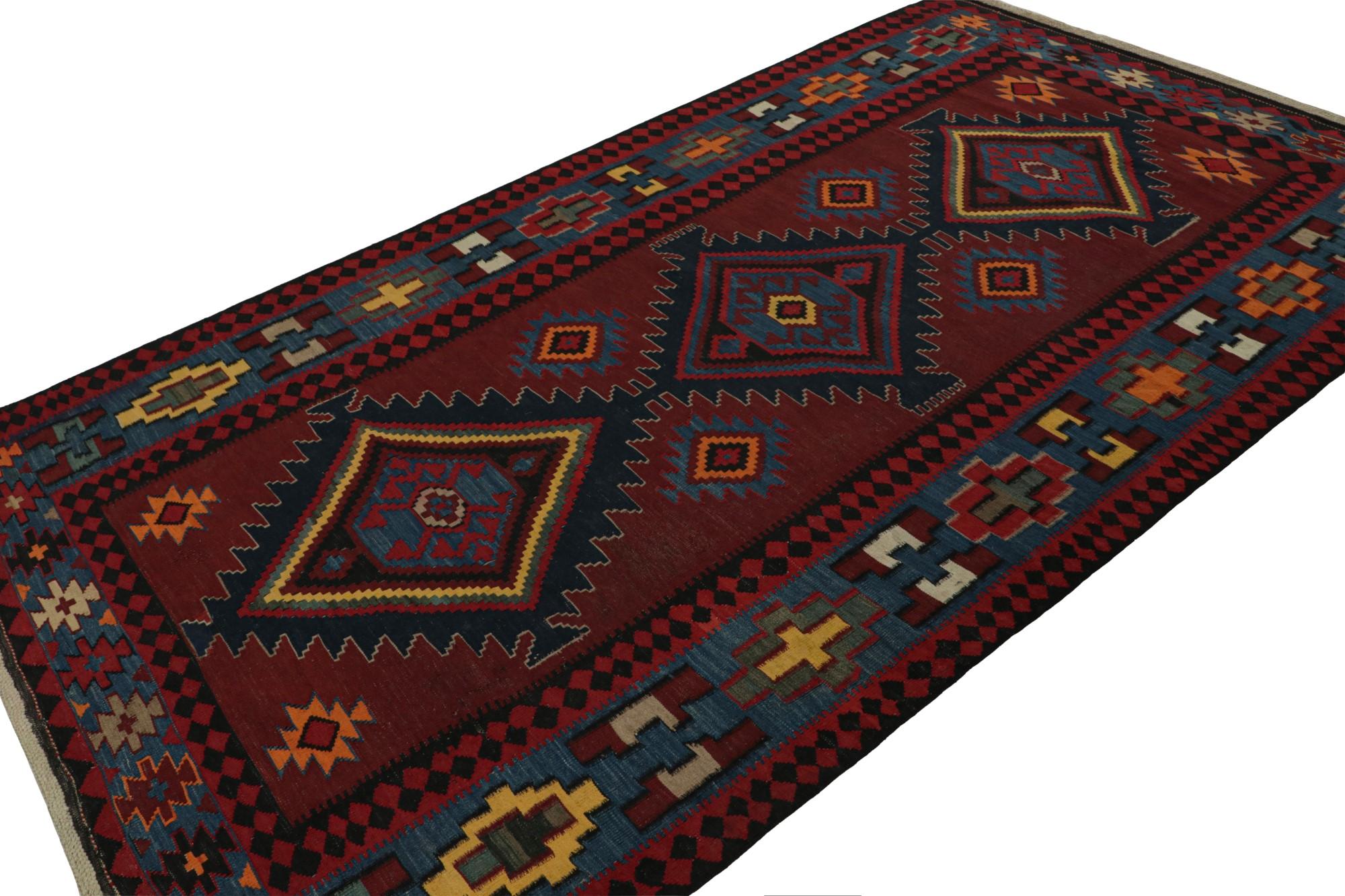 This vintage 5x9 tribal Kilim is a new addition to Rug & Kilim’s mid-century curations. Handwoven in wool, it originates from Afghanistan circa 1950-1960.

On the Design: 

This flat weave carries polychromatic patterns atop a rich red background. 