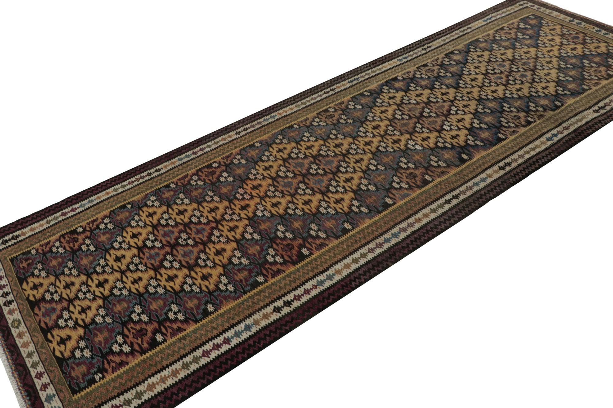 Handwoven in wool circa 1950-1960, this 3x10 vintage Kilim runner rug is a new curation from Rug & Kilim’s primitivist flatweaves. 

On the Design:

This runner boasts polychromatic geometric patterns with notable brown, blue and gold hues. It’s a