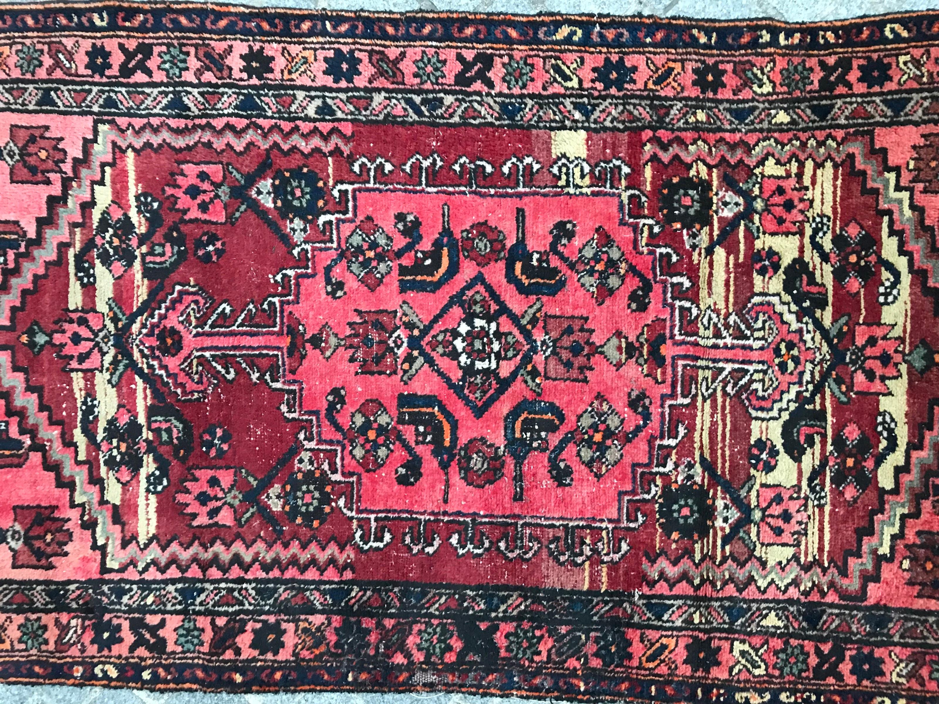Nice tribal rug with a beautiful geometrical design and red field colors, entirely hand knotted with wool velvet on cotton foundation.
