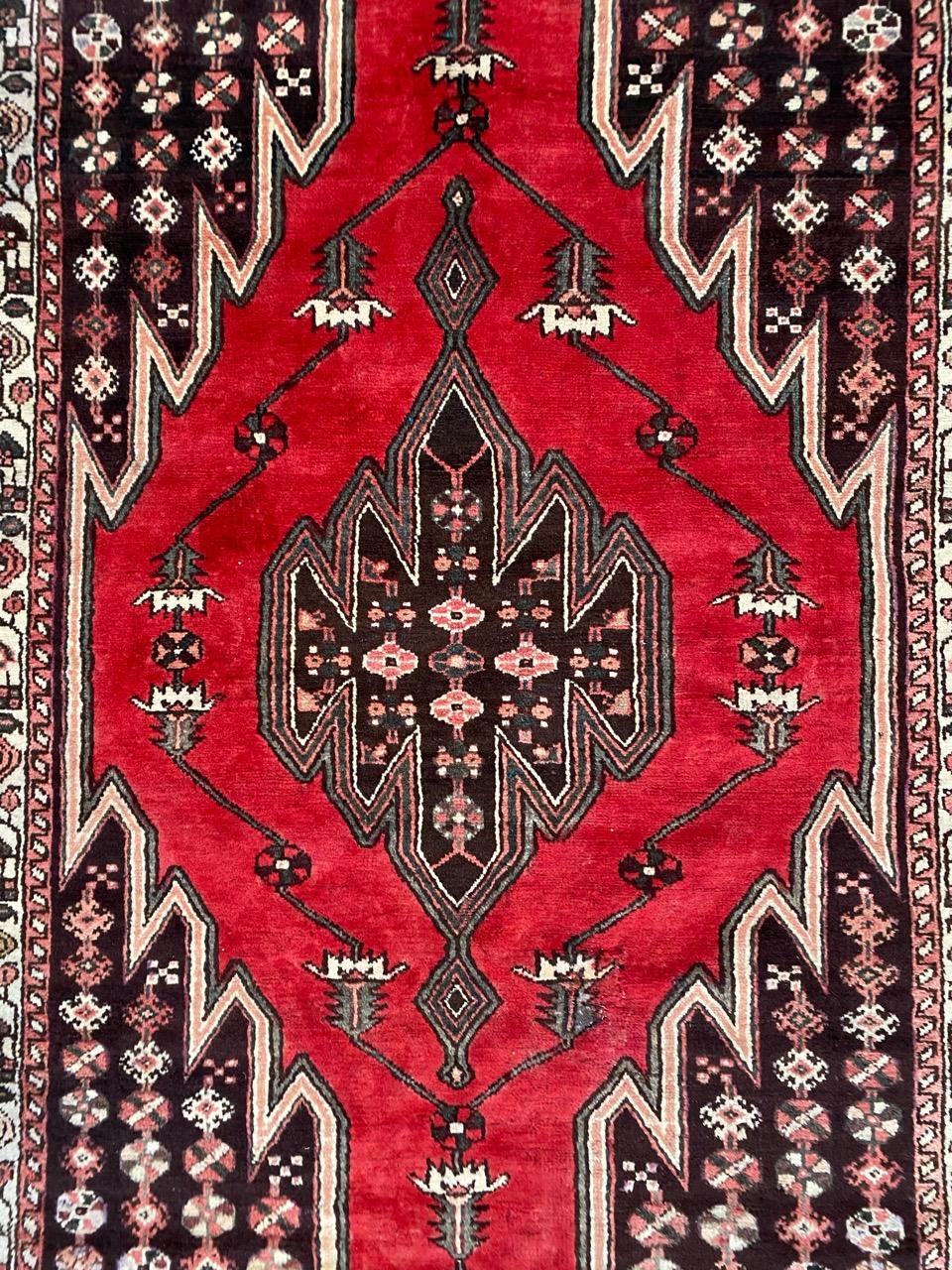 Beautiful midcentury tribal rug with geometrical design and nice colors, entirely hand knotted with wool velvet on cotton foundation.