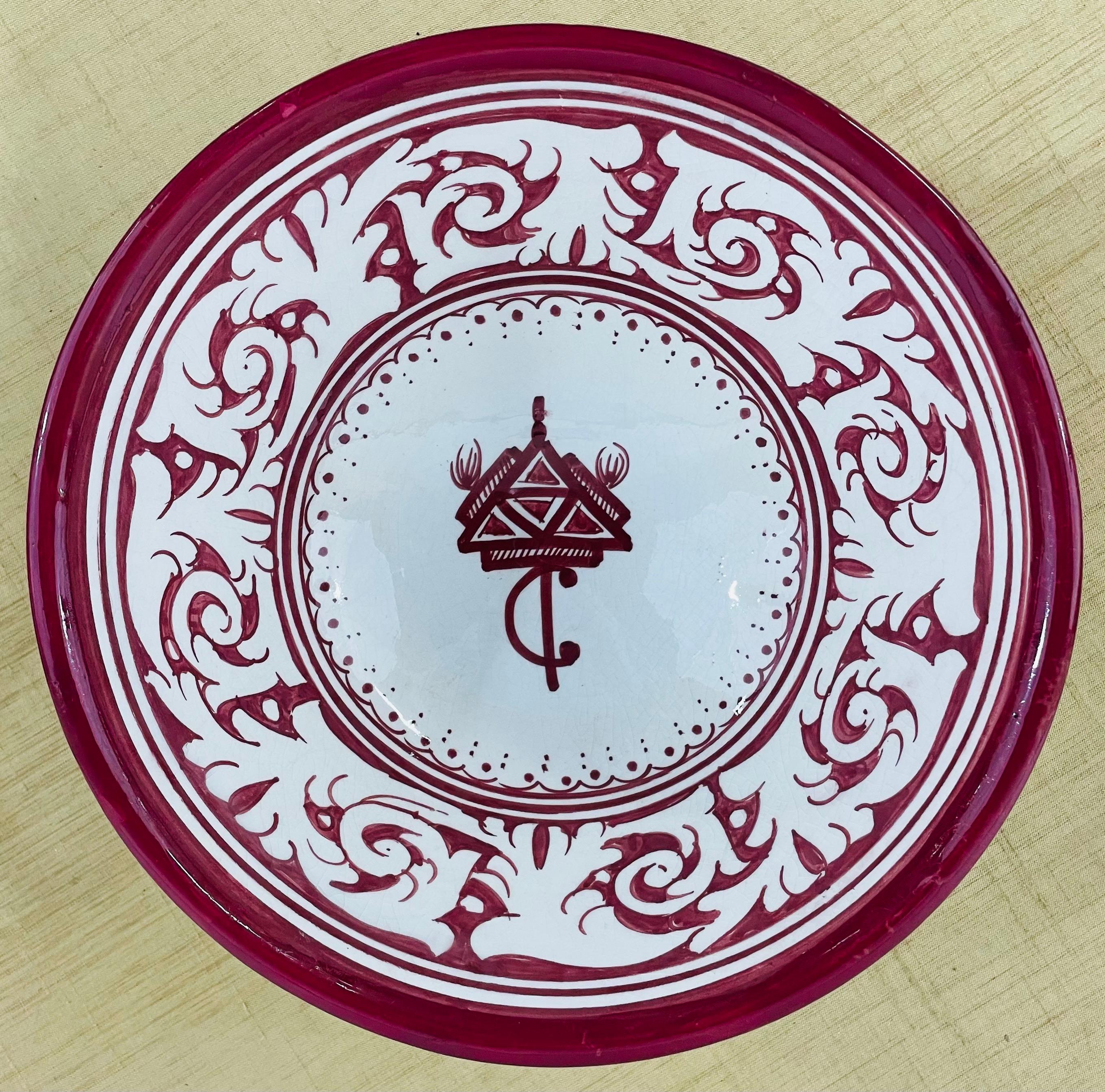 A set of 4 large vintage tribal Moroccan hand painted ceramic bowls. In a white and burgundy tone, each bowl features beautiful floral motifs and a triangle emblem of the Berber tribes of Morocco. 

Dimensions: 10.5