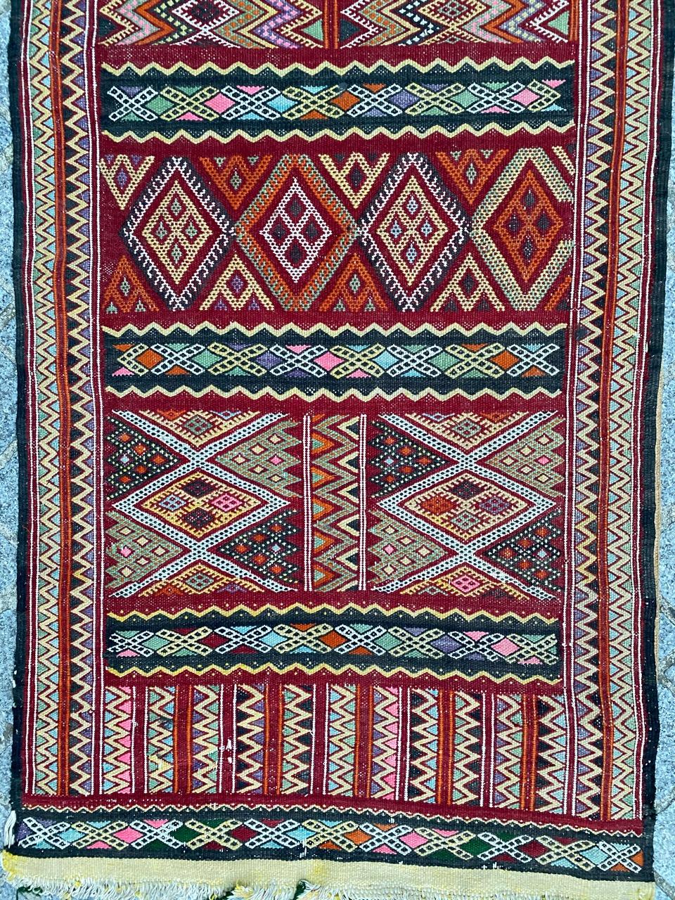 Beautiful colorful long Moroccan Kilim with nice tribal geometrical design and beautiful colors, entirely handwoven with wool on cotton foundation.