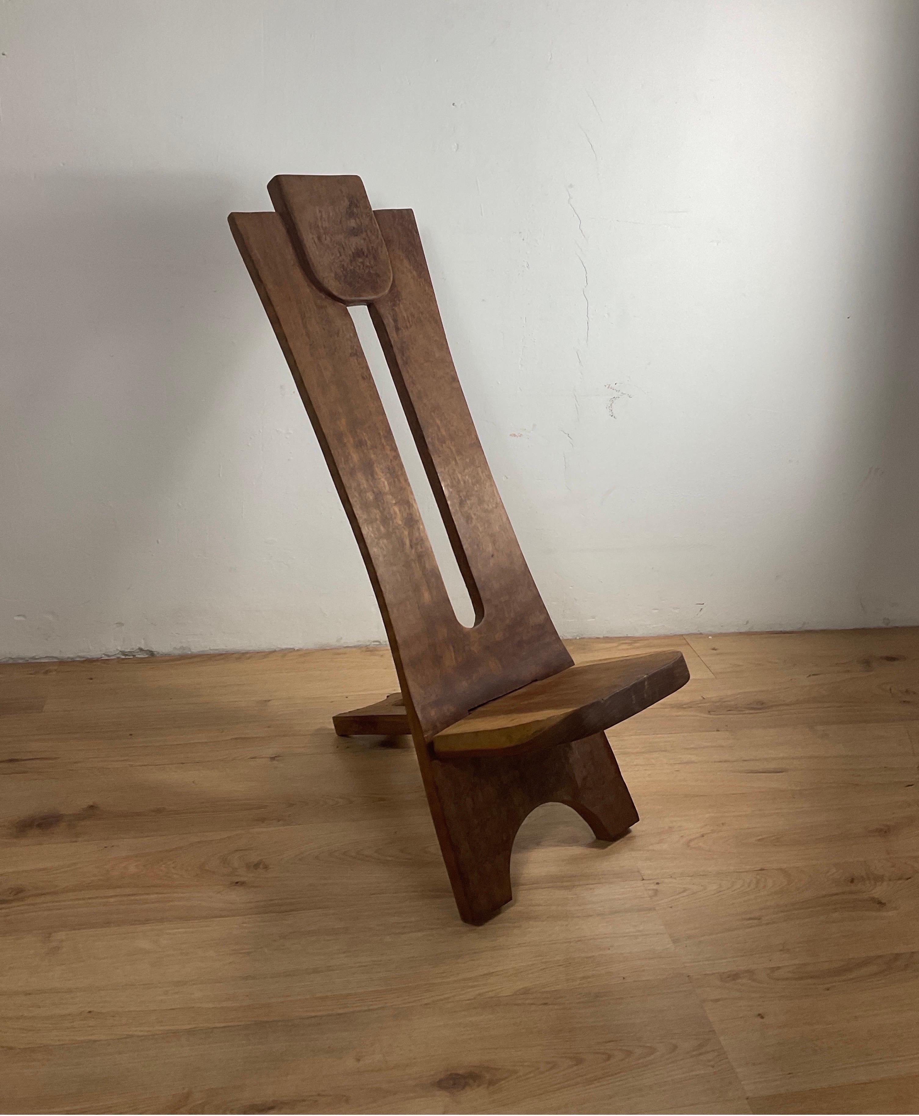 This chair consists of two separate sections of solid wood that hook to form a chair. The chair is surprisingly comfortable.