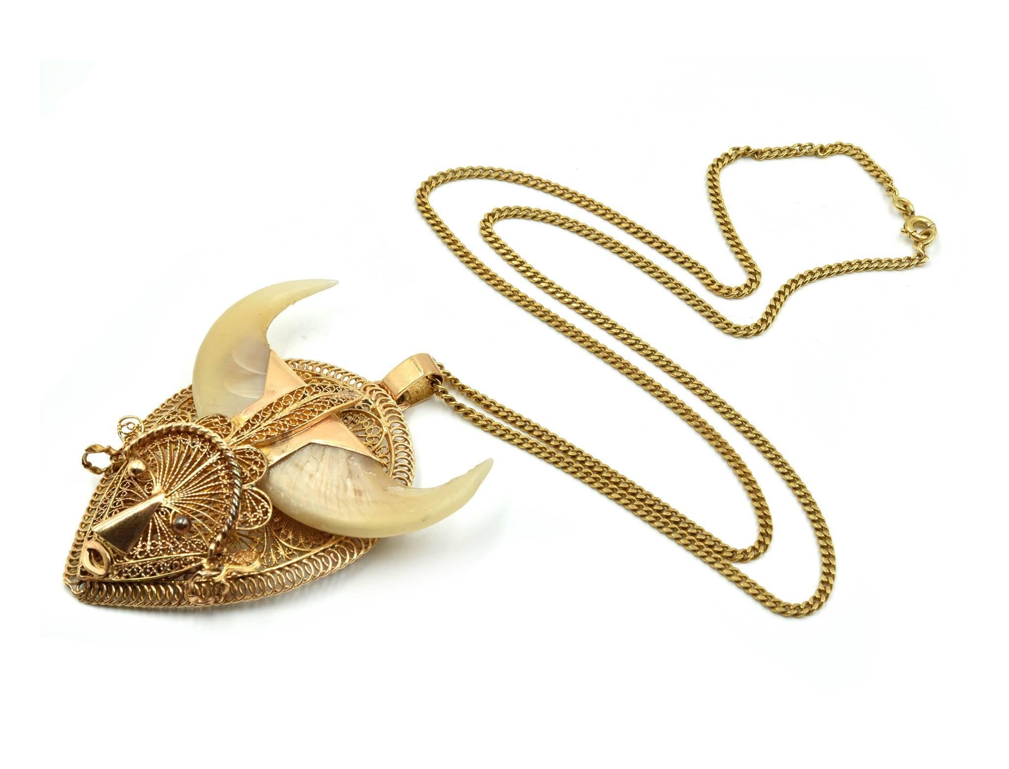 Designer: custom design
Material: 14k yellow gold and two bear claws
Dimensions: pendant is 2 1/2 inches long and 2 inches wide, necklace is 22 inches long
Weight: 35.29 grams


