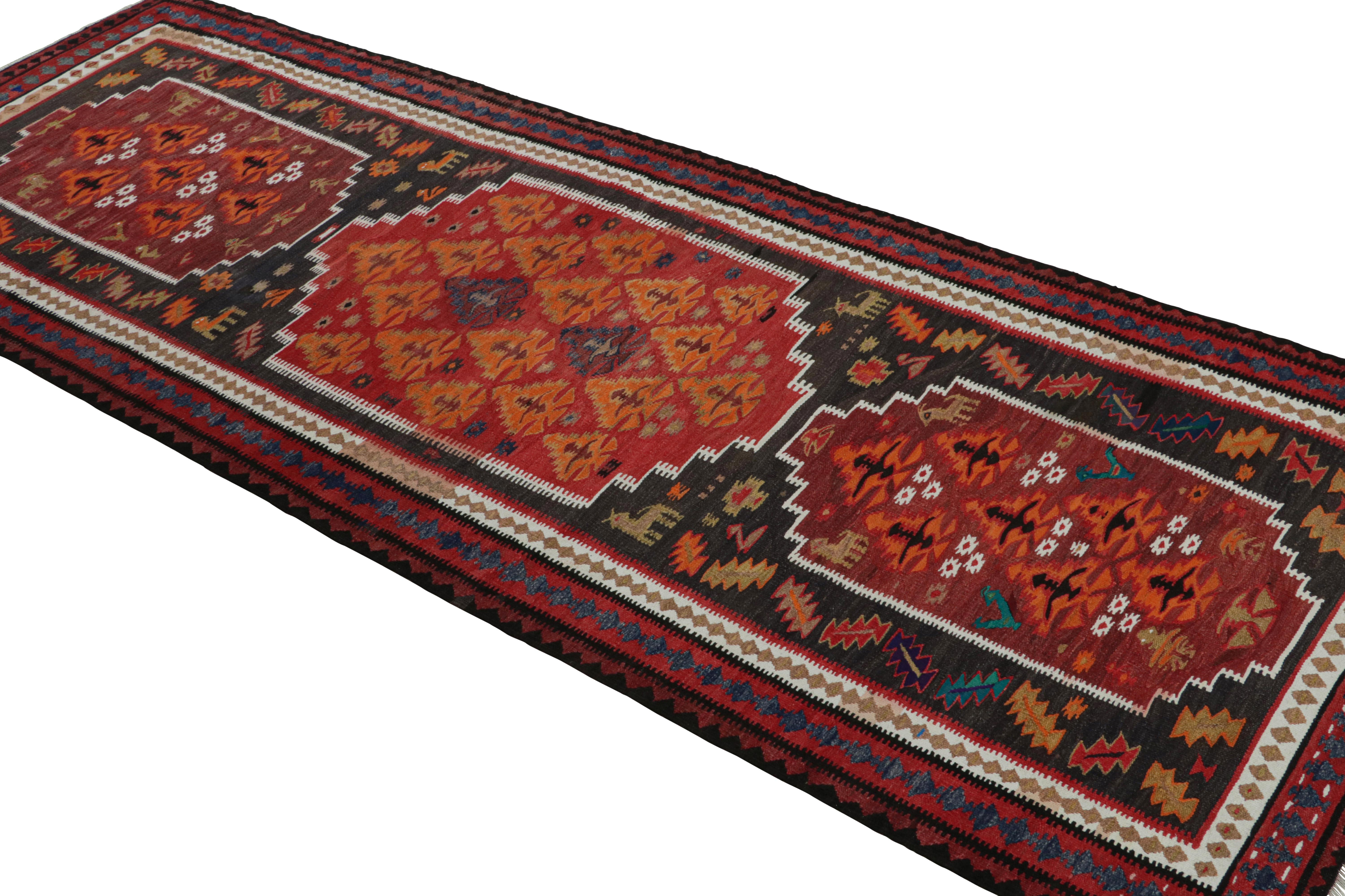 Vintage tribal Persian Kilim runner rug, with Pictorial motifs, from Rug & Kilim
Description: Handwoven in wool, circa 1950-1960, this 3x9 vintage tribal Persian kilim runner rug features a rare design both for its unusual motifs seen in Senneh or