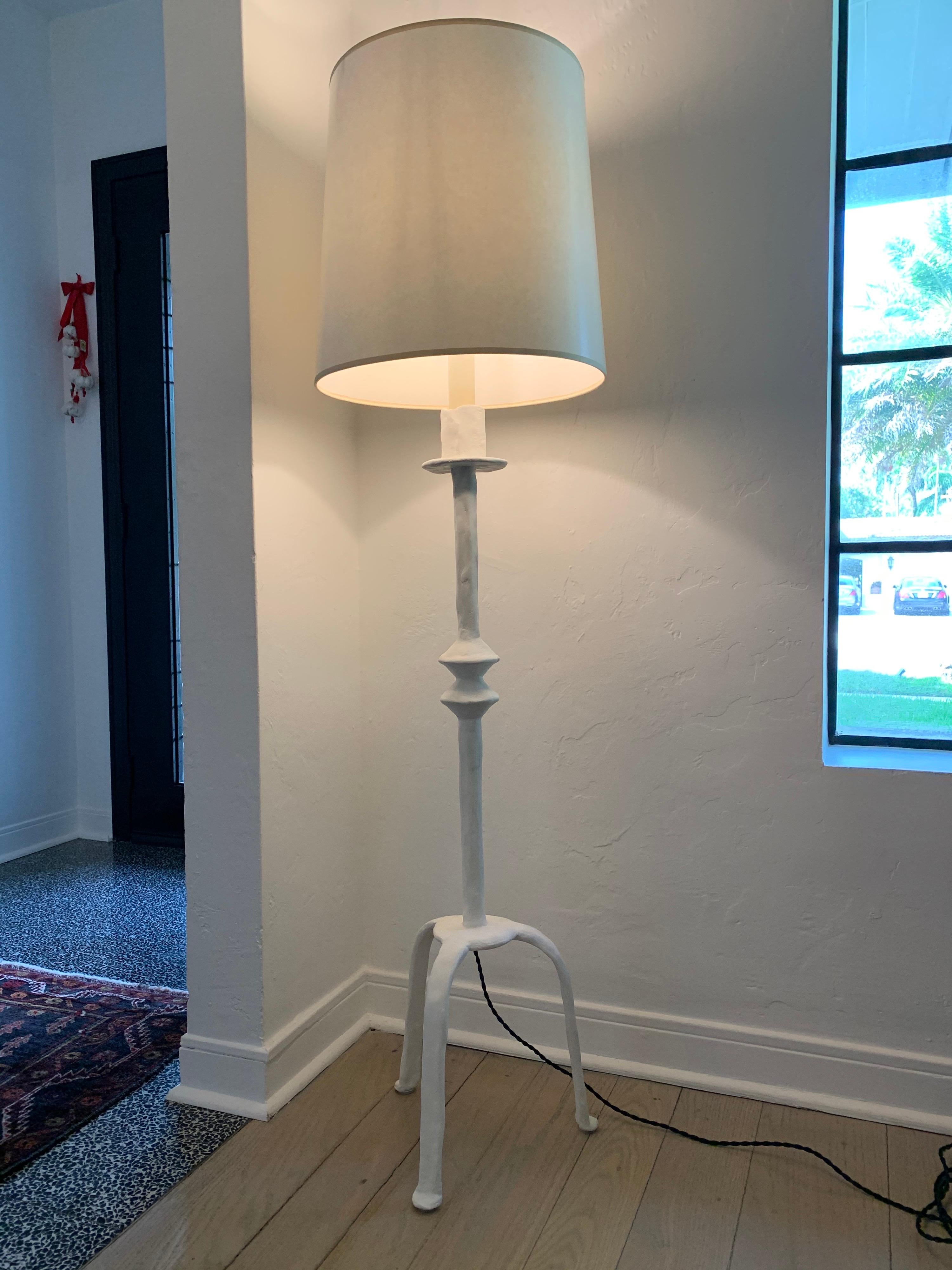 Beautiful plaster over iron floor lamp inspired by Giacometti's tribal designs. Silk rewiring and new socket, ready to use!

Note: Shade not included.
Additional dimensions: Shade is 16 inches tall and 16 inches diameter.