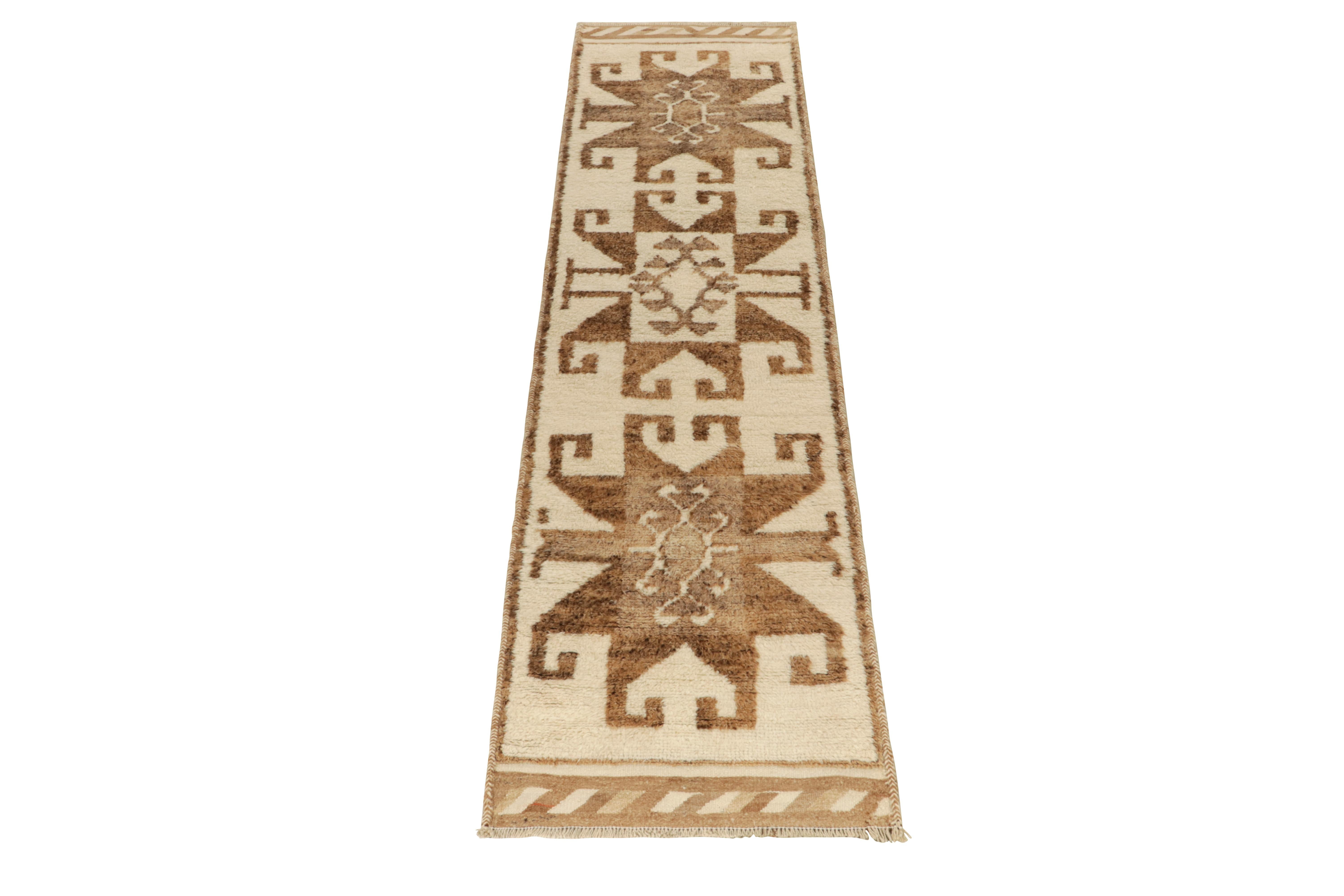 From Rug & Kilim’s vintage selections, a 3x12 hand-knotted wool runner from Turkey bearing textural nomadic appeal. 

The 1950s creation showcases a union of geometric repetition & tribal sensibilities with traditional motifs for a clean look in