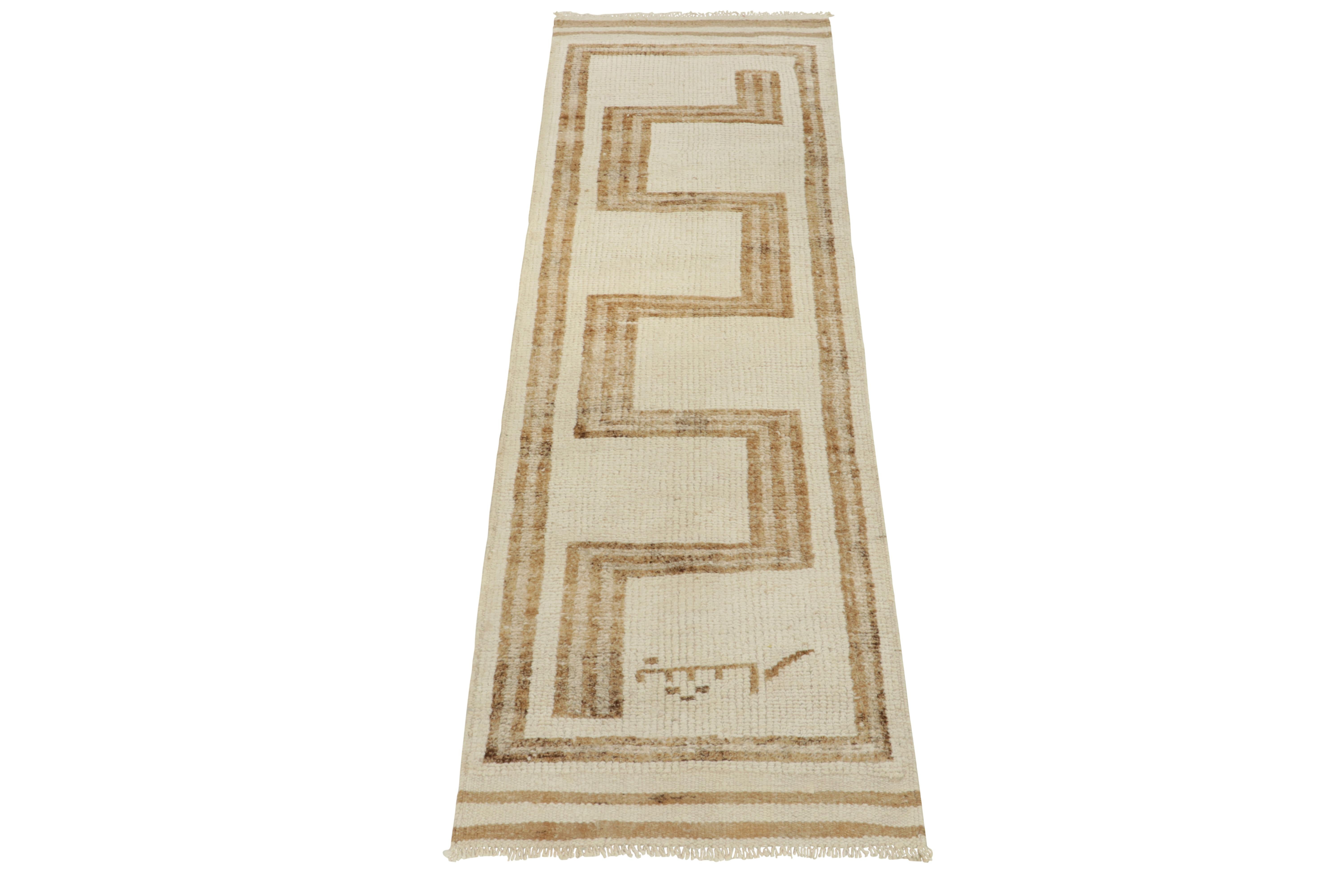 From Rug & Kilim’s vintage selections, a 3x11 hand-knotted wool runner bearing uniquely forgiving nomadic aesthetics. The 1950s creation showcases a maze-like geometric pattern of tribal sensibility with a clean look in creamy white & beige-brown