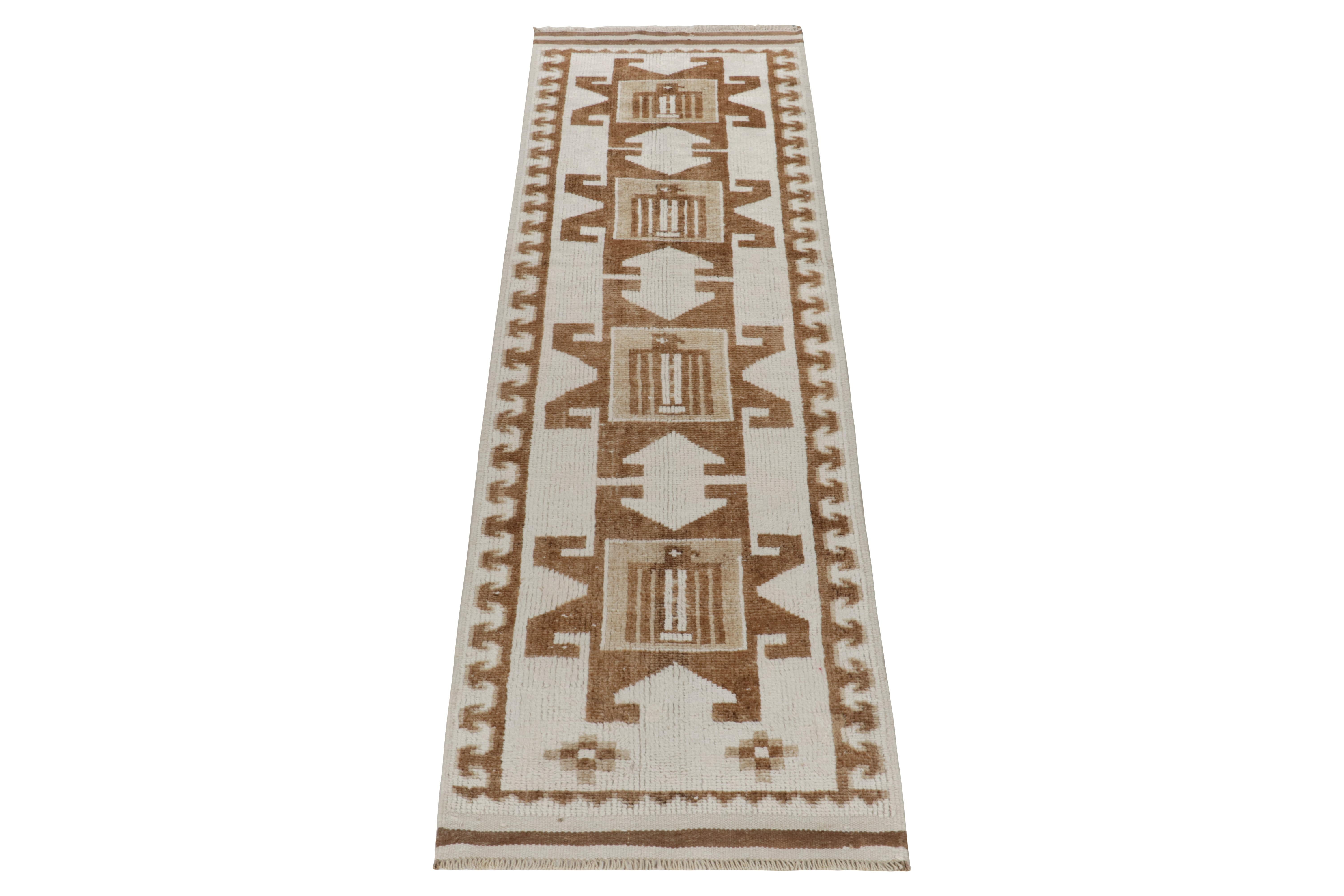 From Rug & Kilim’s vintage selections, a 3x10 hand-knotted wool runner from Turkey bearing nomadic design aesthetics. The 1950s creation showcases a union of geometric repetition & tribal sensibilities for a clean look in off-white & tones of