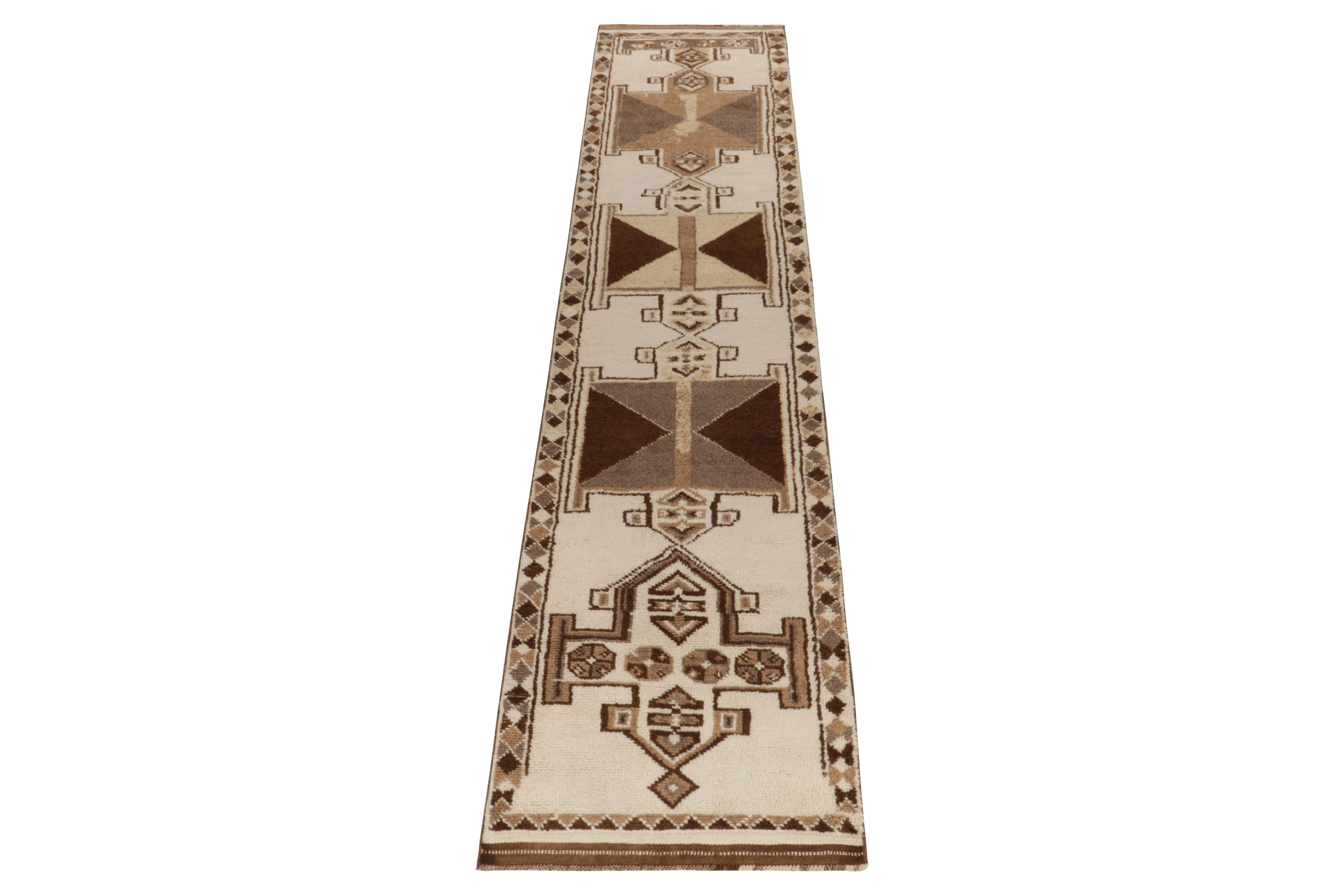 From Rug & Kilim’s vintage selections, a 3x14 hand-knotted wool runner from Turkey among the newest curations of Principal Josh Nazmiyal. 

The 1950s tribal piece showcases traditional motifs on the field in bright white & beige-brown tones,