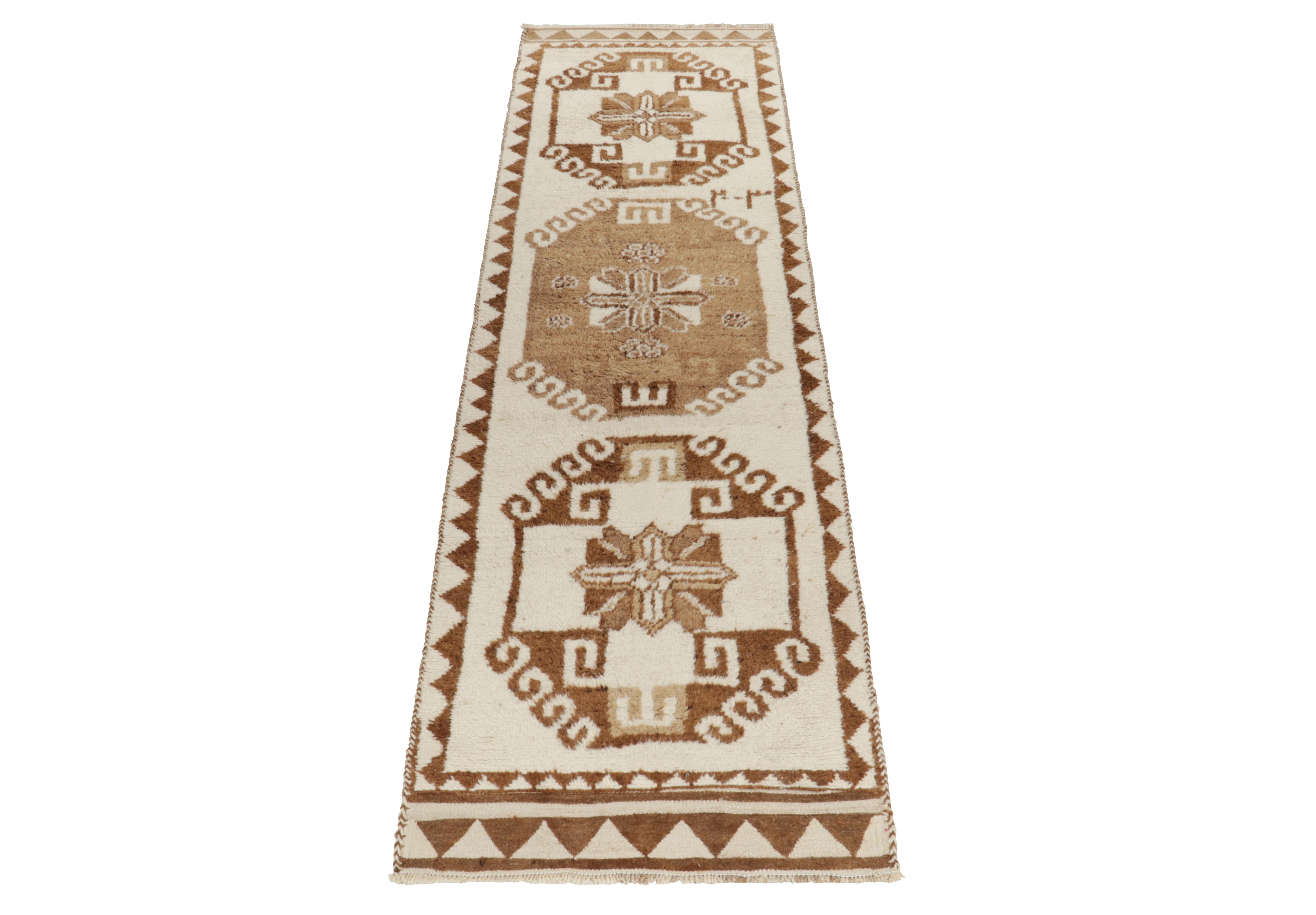From Rug & Kilim’s vintage selections, a 3x12 hand-knotted wool runner of uniquely bright hues for nomadic inspirations. 

This 1950s tribal piece showcases traditional motifs sitting peacefully like medallions on the field in crisp white &