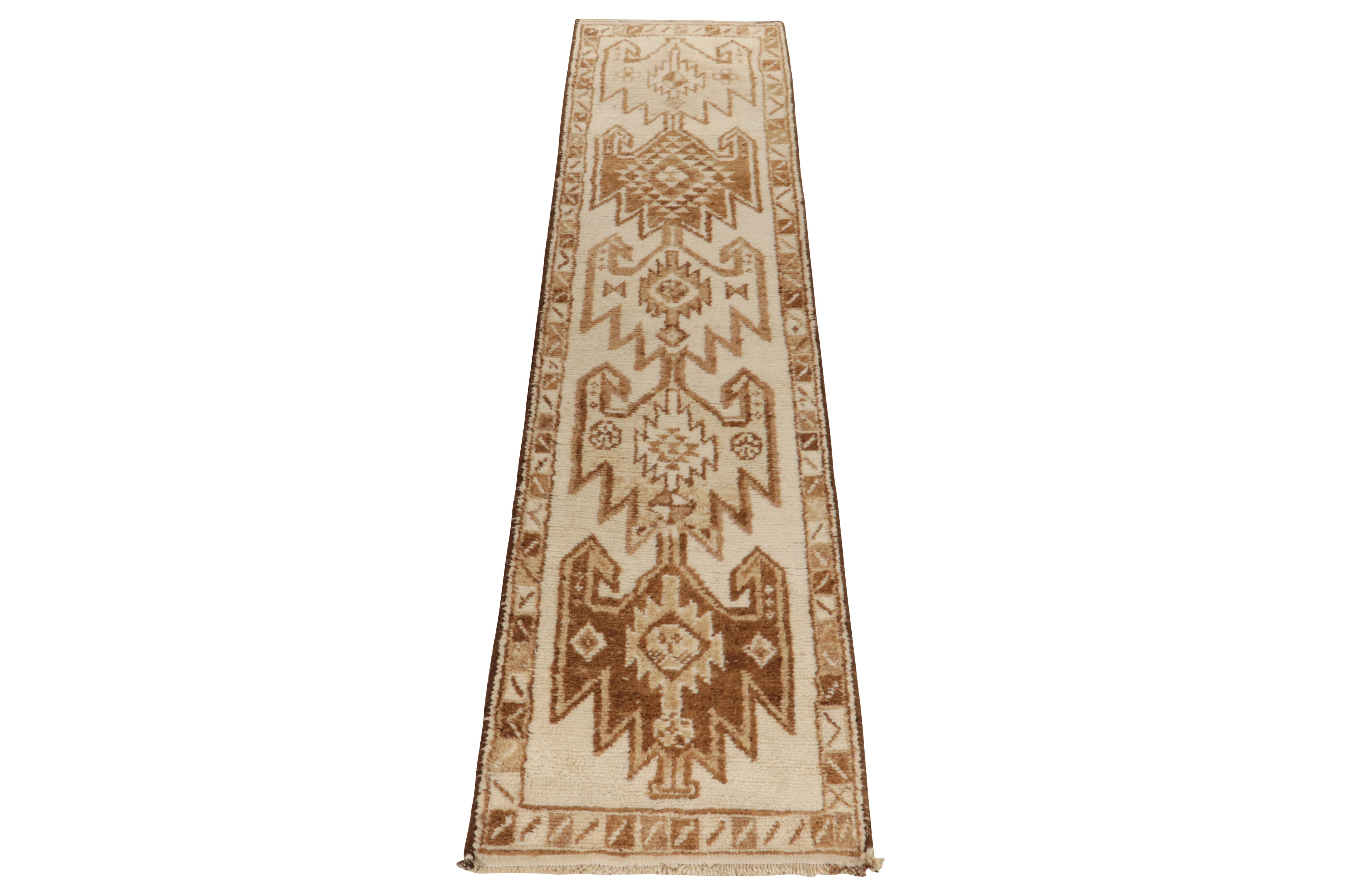 From Rug & Kilim’s vintage selections, a 3x13 hand-knotted wool runner of uniquely bright hues and lush, shag wool texture. 

This 1950s tribal piece showcases traditional motifs sitting peacefully like medallions on the field in creamy white &