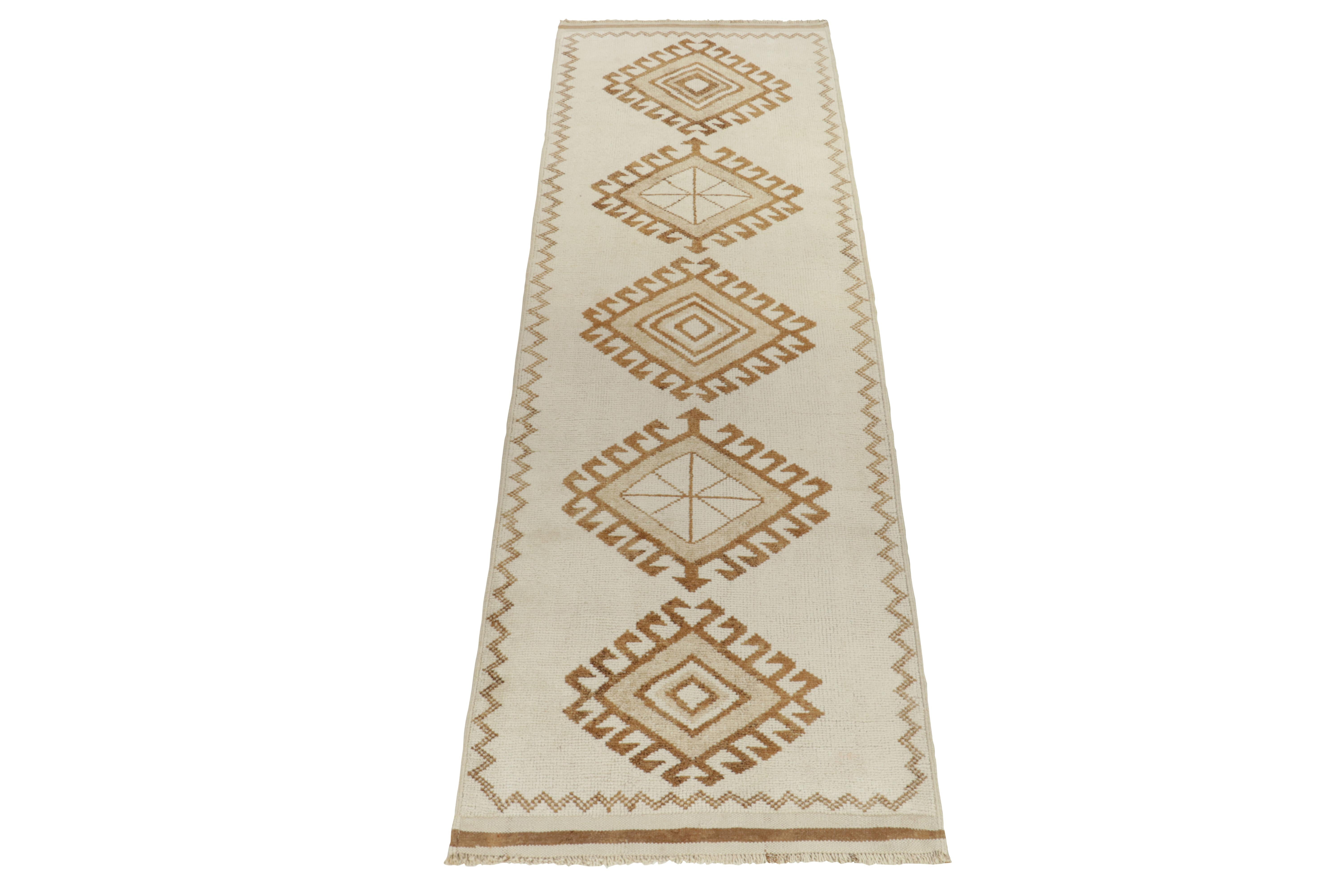 From Rug & Kilim’s vintage selections, a 4x12 hand-knotted wool runner a refreshing nomadic inspiration. The 1950s tribal piece showcases traditional motifs sitting peacefully on the field in creamy white & gold-brown tones further complementing the