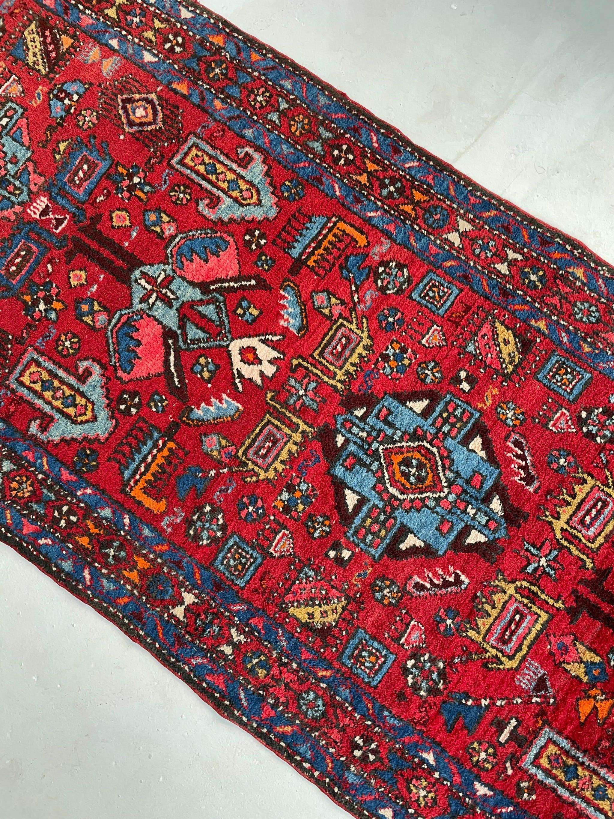 Unbelievably charming vintage Tribal Runner with Nomadic Motifs & Gorgeous colors 

About: One of the most charming, playful, and joyous runners we've ever had! So many happy colors fill up the wonderful camels, sheep, birds, and other animals
