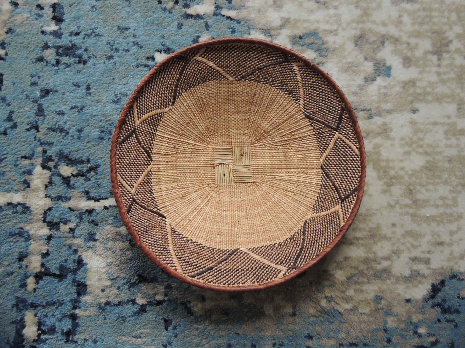 Vintage tribal tan and brown woven round African basket.
Tribal woven pattern.
Size: 14.5