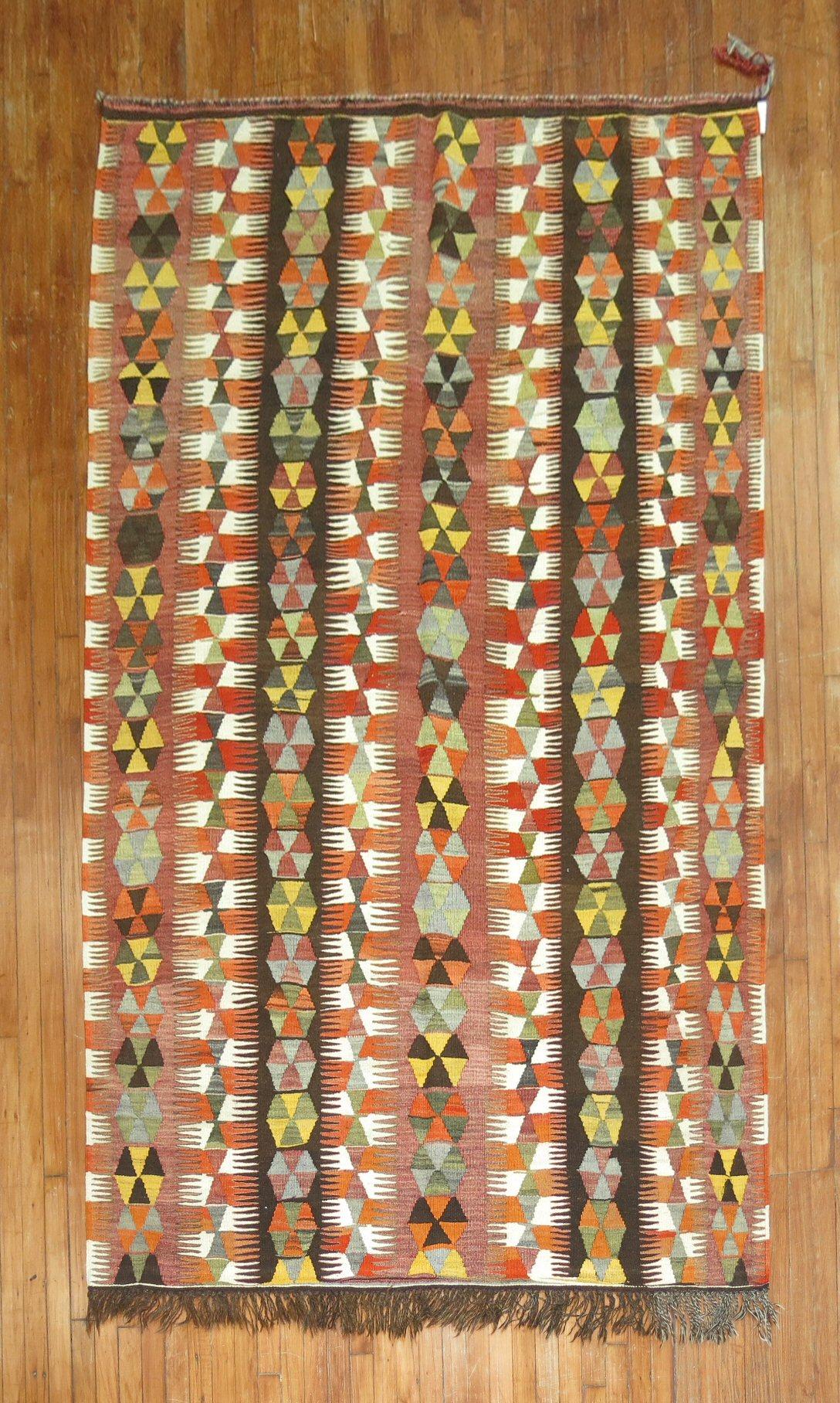 Mid 20th century Turkish Kilim with an all-over tribal design

Measures: 5'7'' x 9'6''.