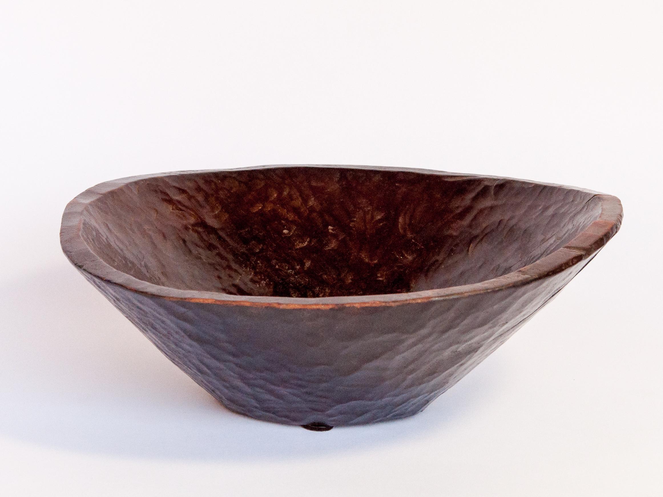 Vintage tribal wooden bowl from Ethiopia, mid-20th century.
What is noteworthy about this wooden bowl is its rich dark patina, a result of years of use, and its beautiful texture, a result of how it was shaped by hand, cutting and forming with an