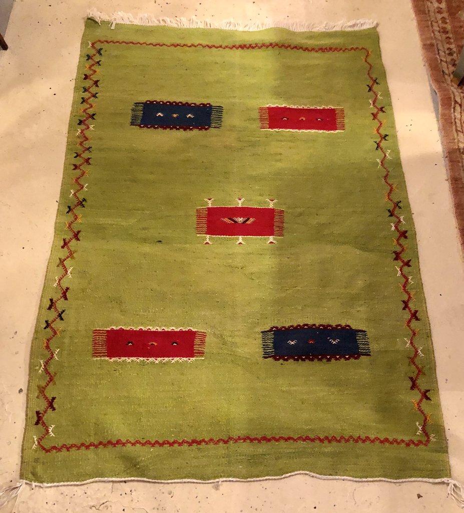 With a Minimalist pattern with abstract and Berber design elements, this flat-weave rug features a fresh green color. The vintage rug is handwoven and made of wool and all-natural vegetable dyes.



Dimensions: 58