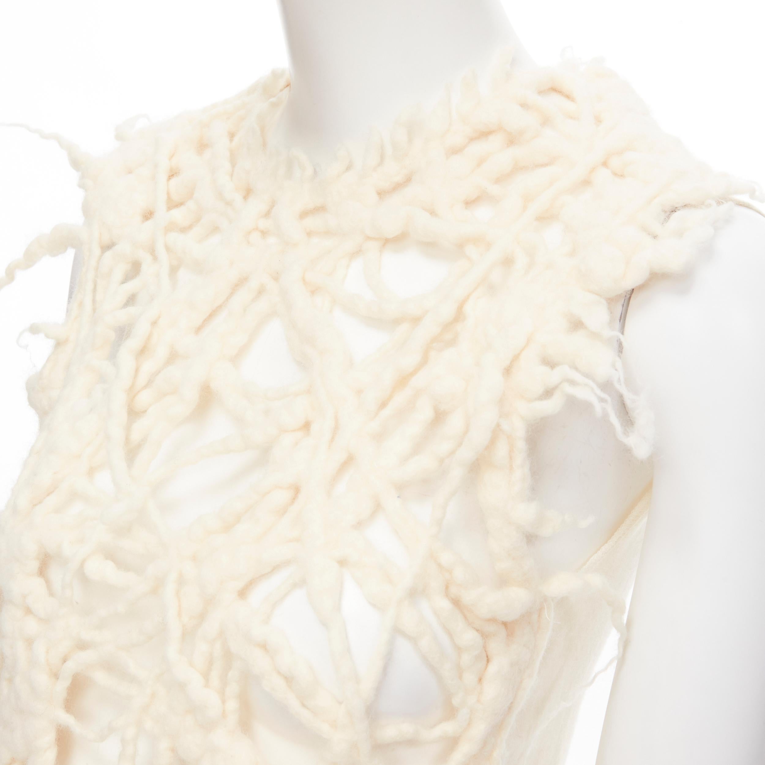 vintage TRICOT COMME DES GARCONS 1992 cream boiled wool dreads-lock vest S Reference: CRTI/A00418 
Brand: Comme Des Garcons 
Collection: 1992 
Material: Wool 
Color: Cream 
Pattern: Solid 
Made in: Japan 

CONDITION: 
Condition: Excellent, this item