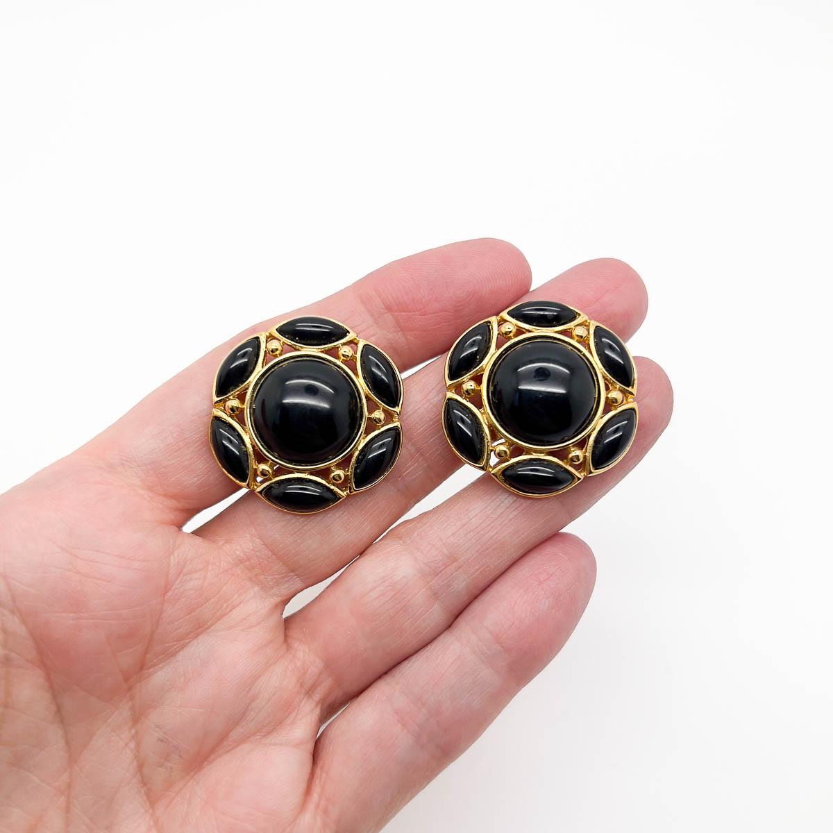 A super stylish pair of Vintage Trifari Black Earrings. Gorgeous cabochons in navette and rounds adorn a lustrous gold modernist design. The quintessential jewel capsule piece that will you will call upon countlessly.
Trifari are undoubtedly