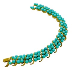 Vintage TRIFARI crown gold tone faux turquoise designer bracelet