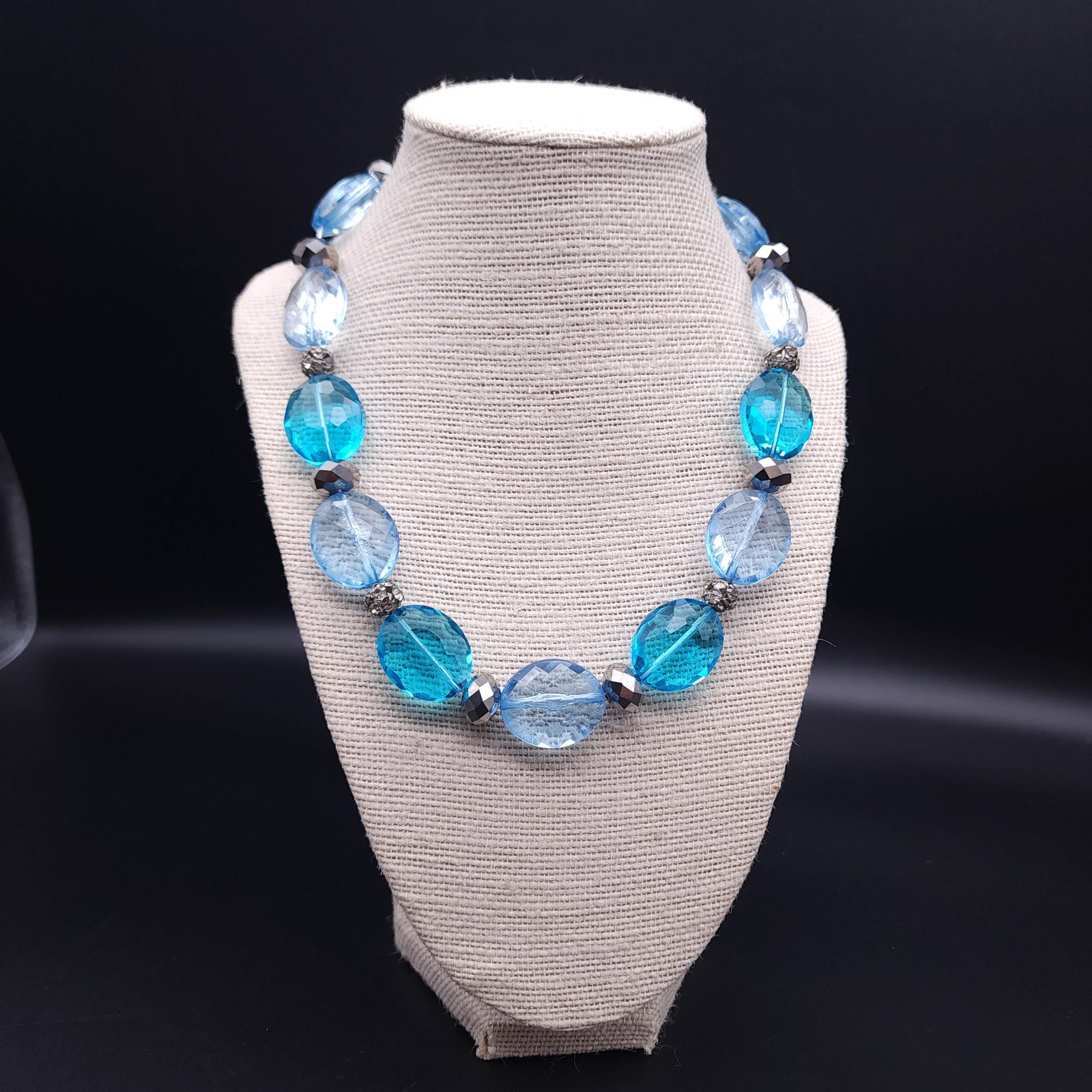 Discover the elegance of the past with the vintage Trifari Crown necklace, a timeless piece that exudes classic charm. This exquisite necklace features 1-inch faceted light-sapphire and aquamarine crystals, interspersed with pave crystal balls and