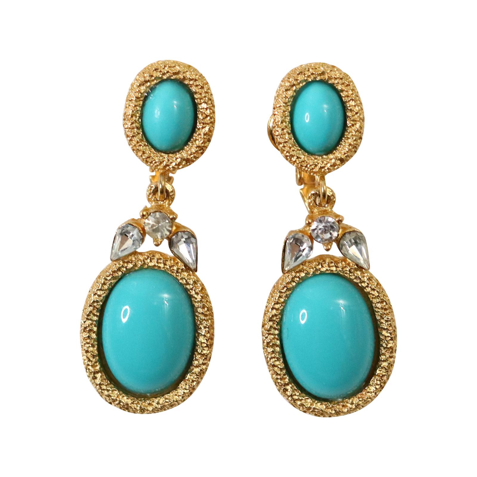 Vintage Trifari Gold Tone with Faux Turquoise Earrings Circa 1980s.  These small but chic earrings feature a drop piece, and on top are three pieces of diamanté that enhance the look.  They could pass for fine jewelry.  Clip on.

These pieces are
