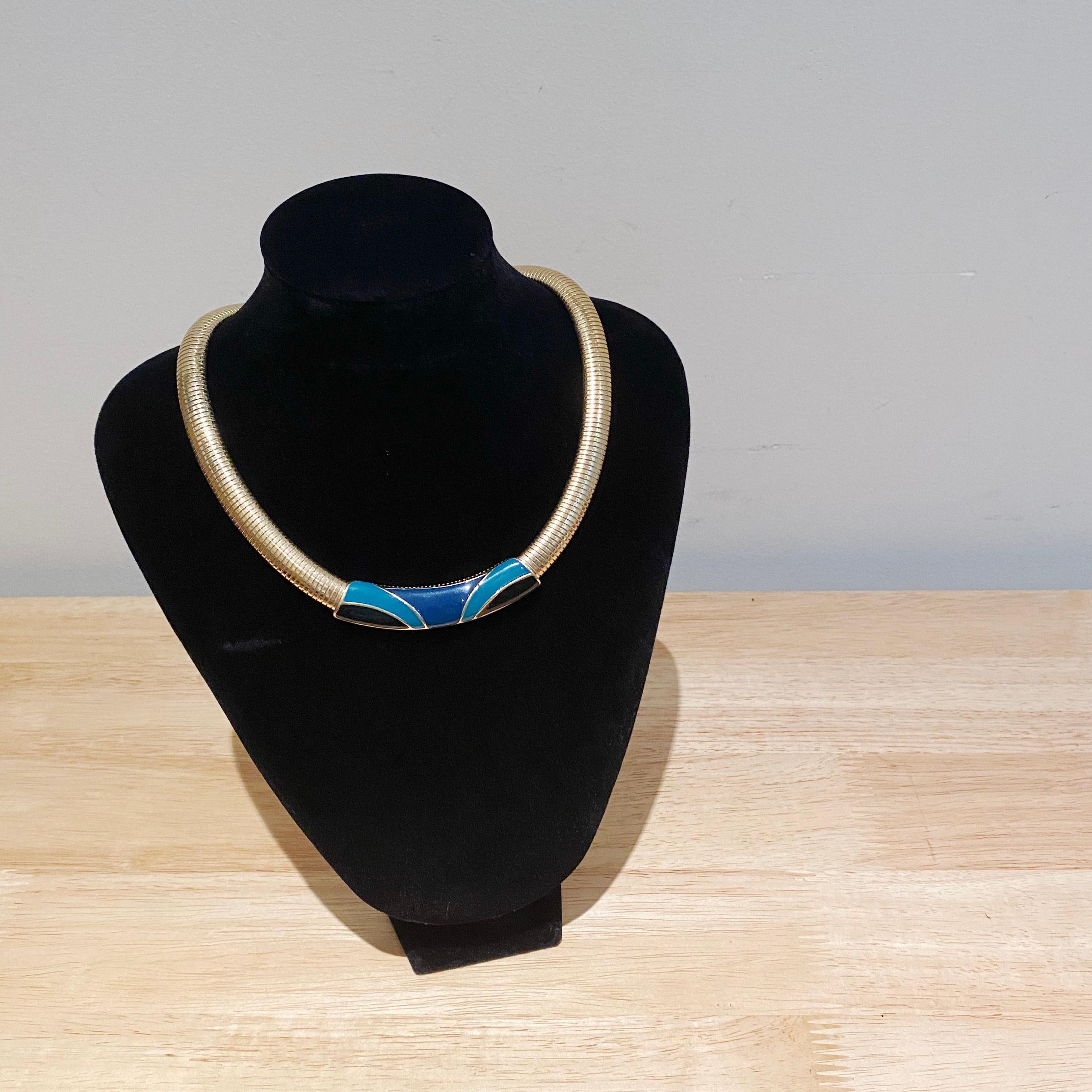 Sleek vintage 80s, Trifari choker style omega necklace. In good vintage condition. Easily styled with contemporary clothing trends. 