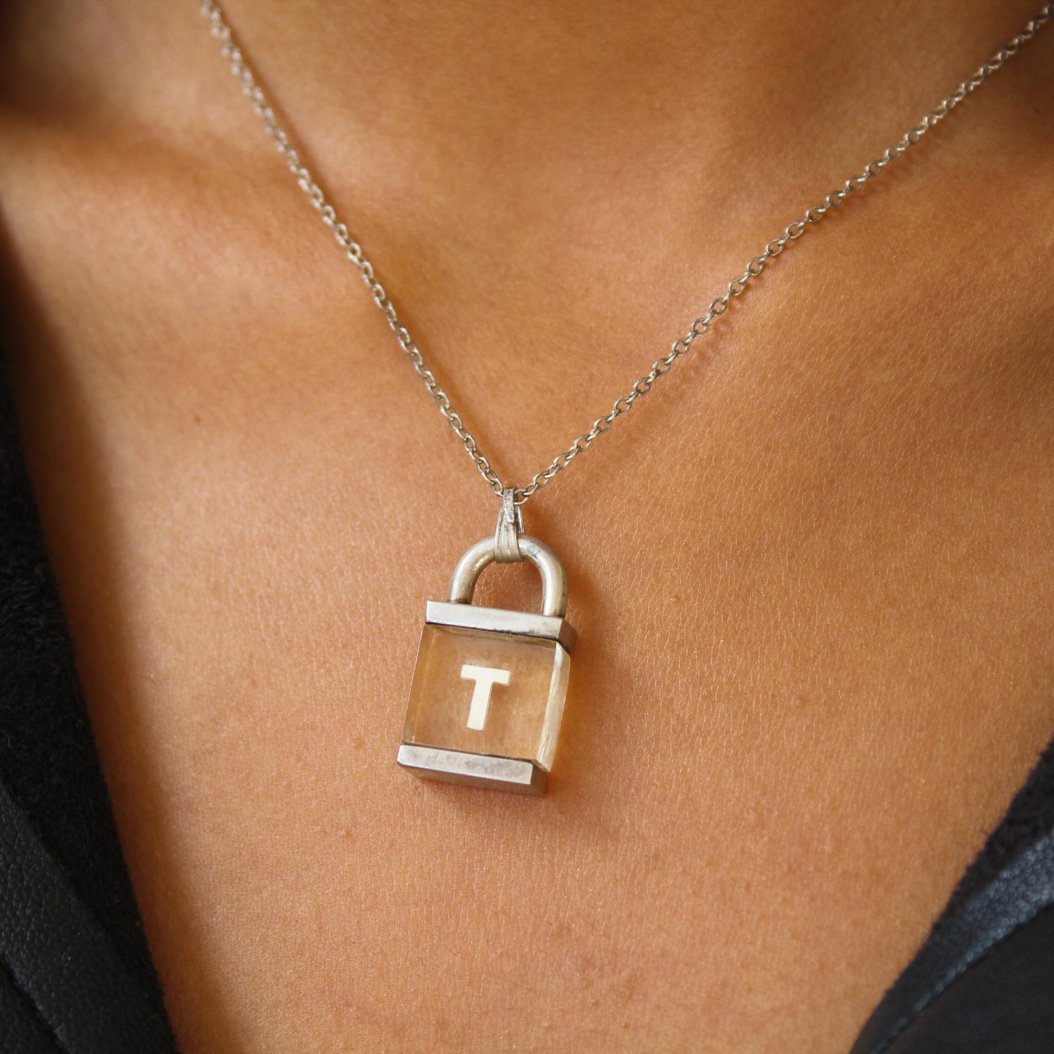 Vintage Trifari 1950s Necklace

A super cool and rare sterling silver padlock pendant from Trifari, one of the world's most famous costume jewellers. Made in the US in the 1950s, this amazing necklace is crafted from real silver, featuring a fine