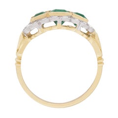 Vintage Trilogy Emerald and Diamond Halo Ring, circa 1950s
