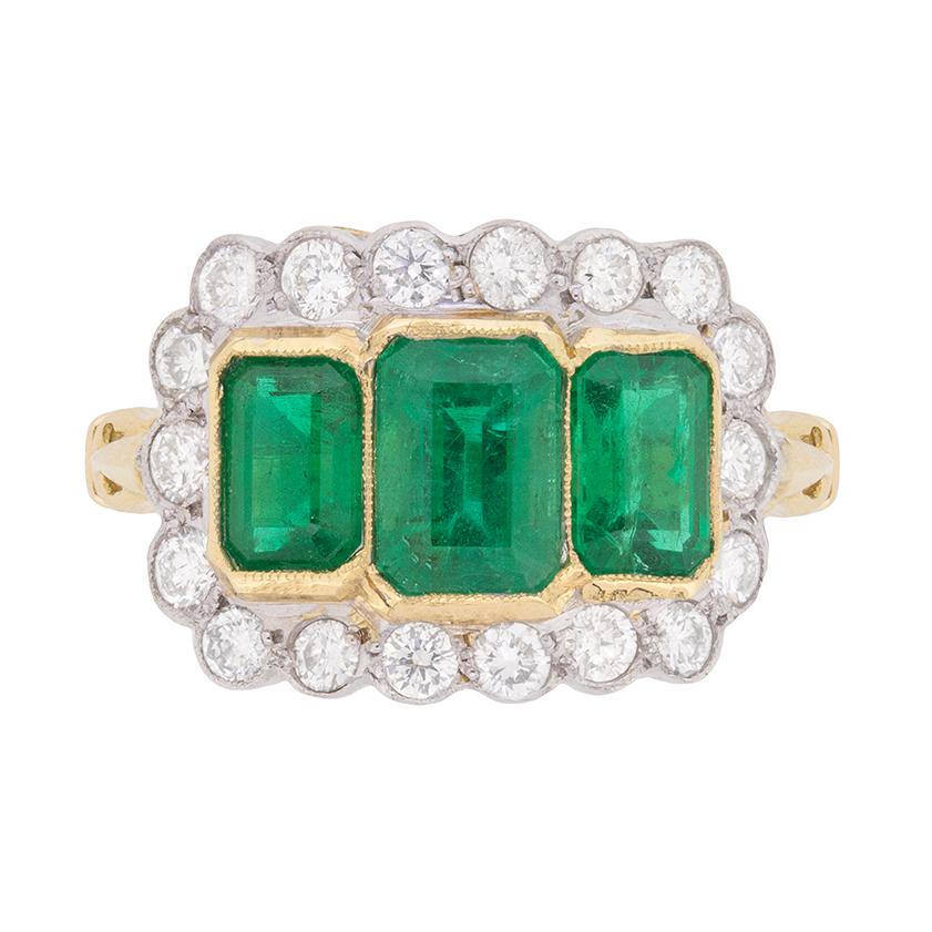 Vintage Trilogy Emerald and Diamond Halo Ring, circa 1950s For Sale