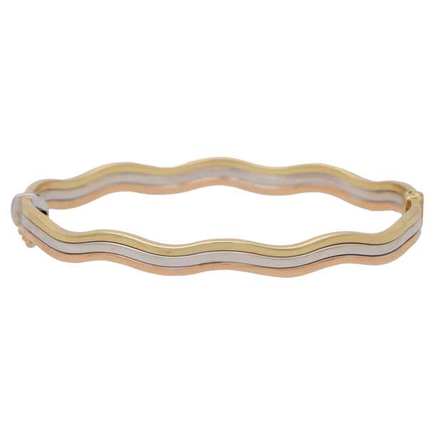 Vintage Trinity Wave Bangle in 9k Gold For Sale at 1stDibs