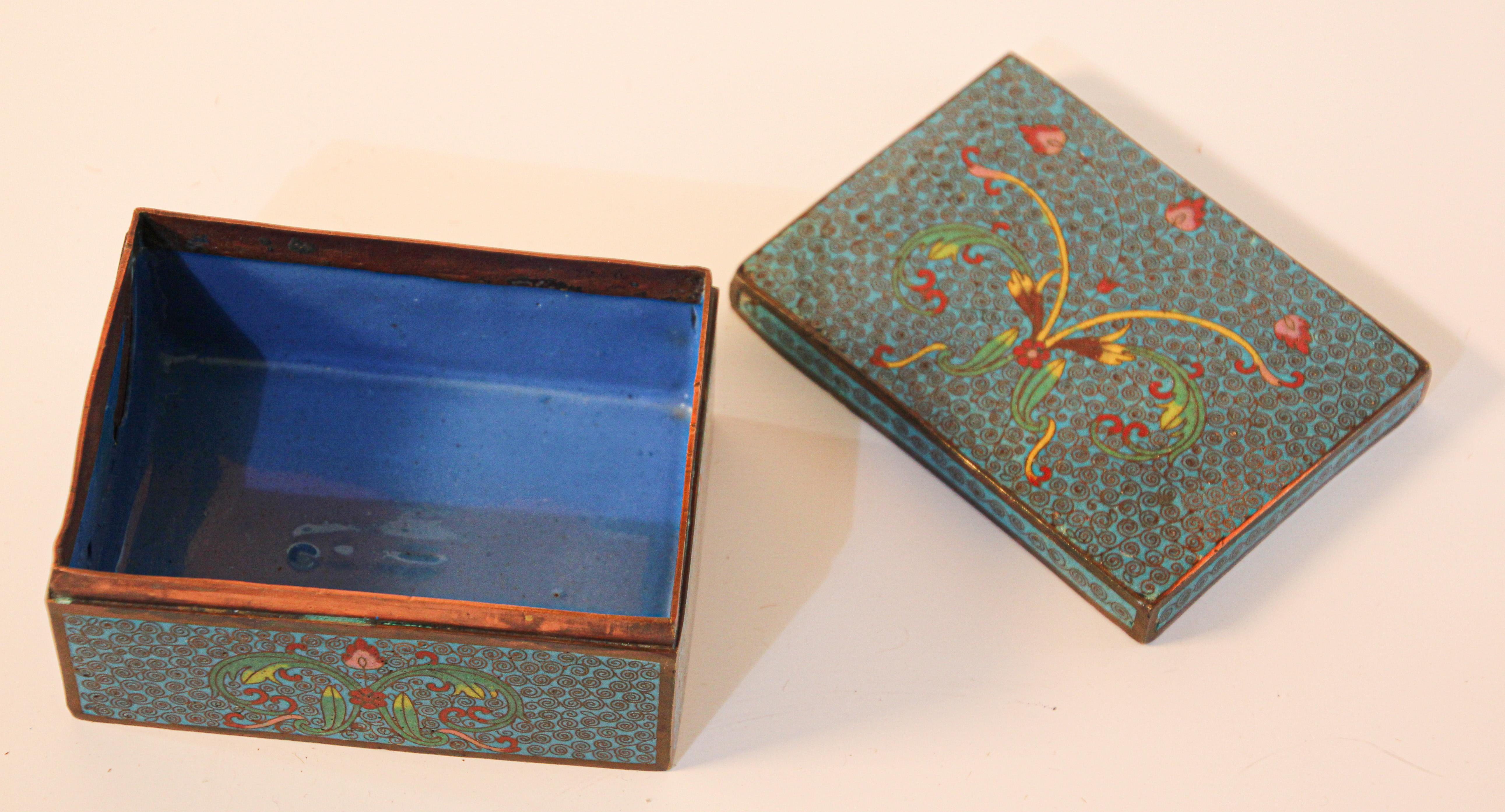 Vintage metal trinket box with hand painted Asian floral on blue background.
Metal brass box hand painted in blue colors.
Dimensions: Width 3.5, depth 4.5, height 2.25 in.
Rectangular shape beautiful collectible Asian box.