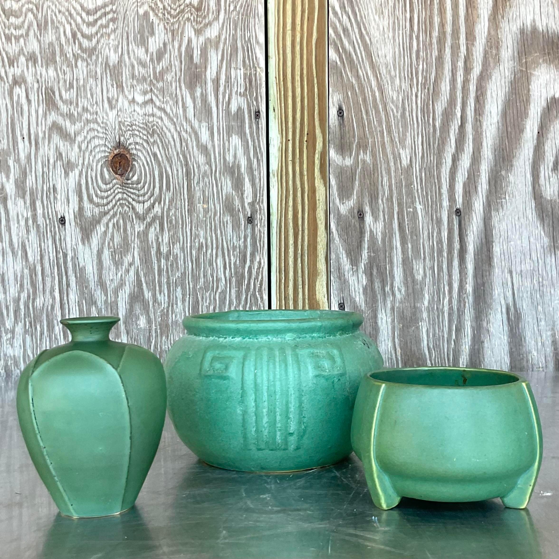 Infuse your home with timeless American charm with this vintage trio of matte glazed ceramic vases. Crafted with attention to detail, their understated elegance and versatile design effortlessly complement any décor, adding a touch of sophistication