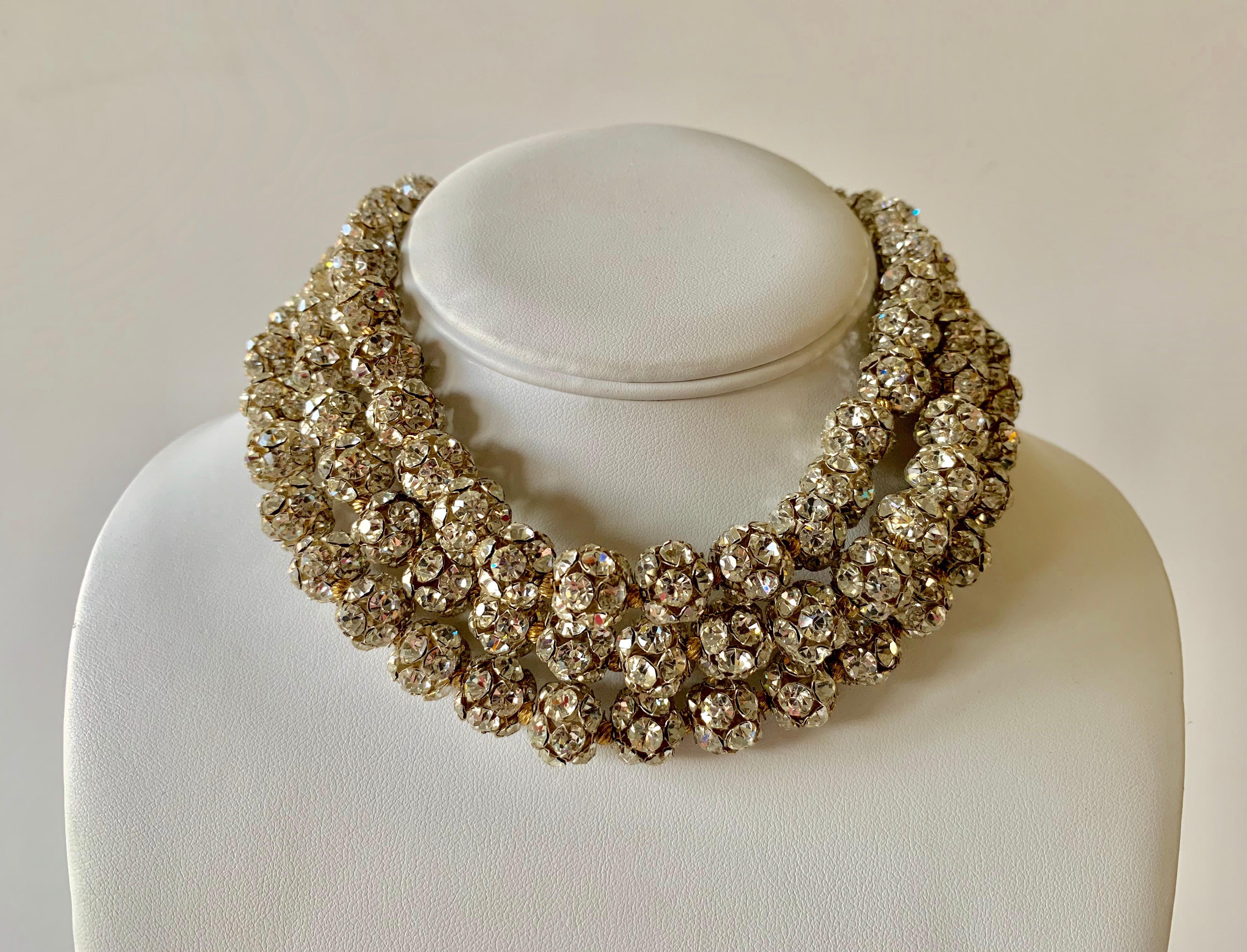 Unusual dramatic vintage triple strand rondelle diamante statement necklace. The necklace features a simple yet bold design, comprised out of silver-tone and gold-tone metal with round rondelle beads which are covered by clear rhinestones in three