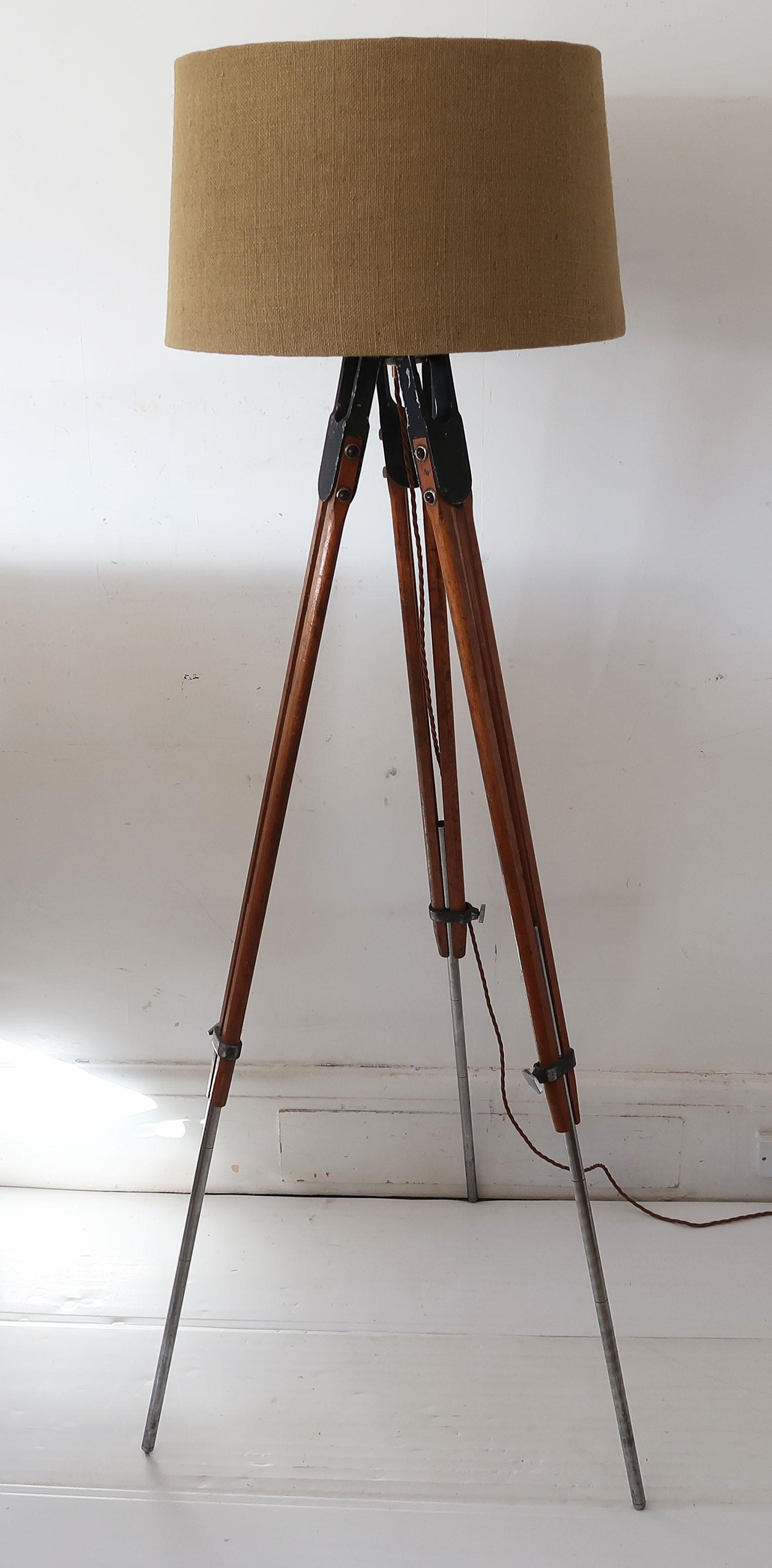 Originally a surveyors tripod. The tubular metal legs are adjustable.

The piece has been converted to a light fitting.

The height measurement I give below relates to the position in the picture.

It has been wired to UK standards. The burlap shade