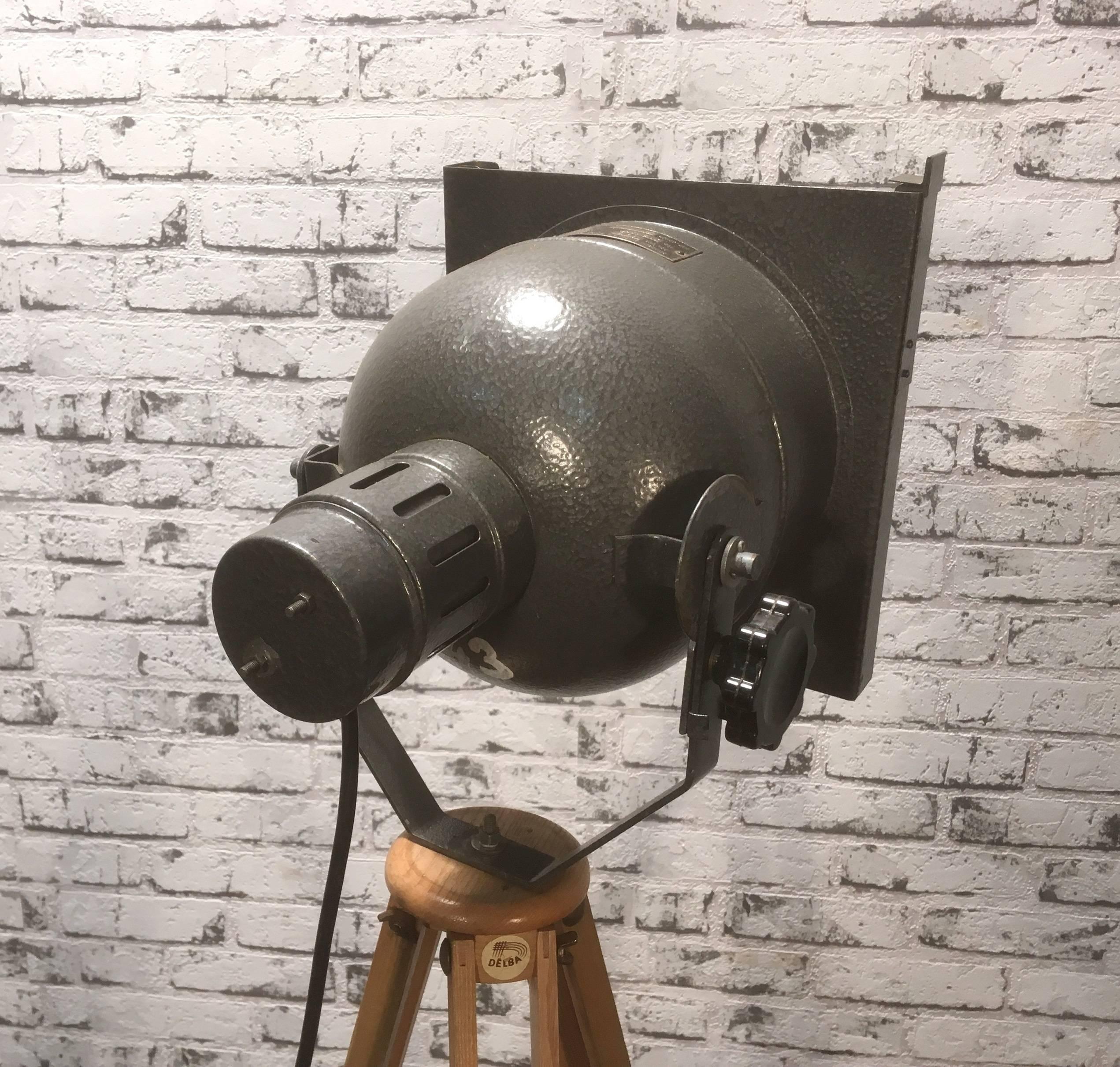 This theater spotlight stands on a tripod and was produced in the Czech Republic.
 