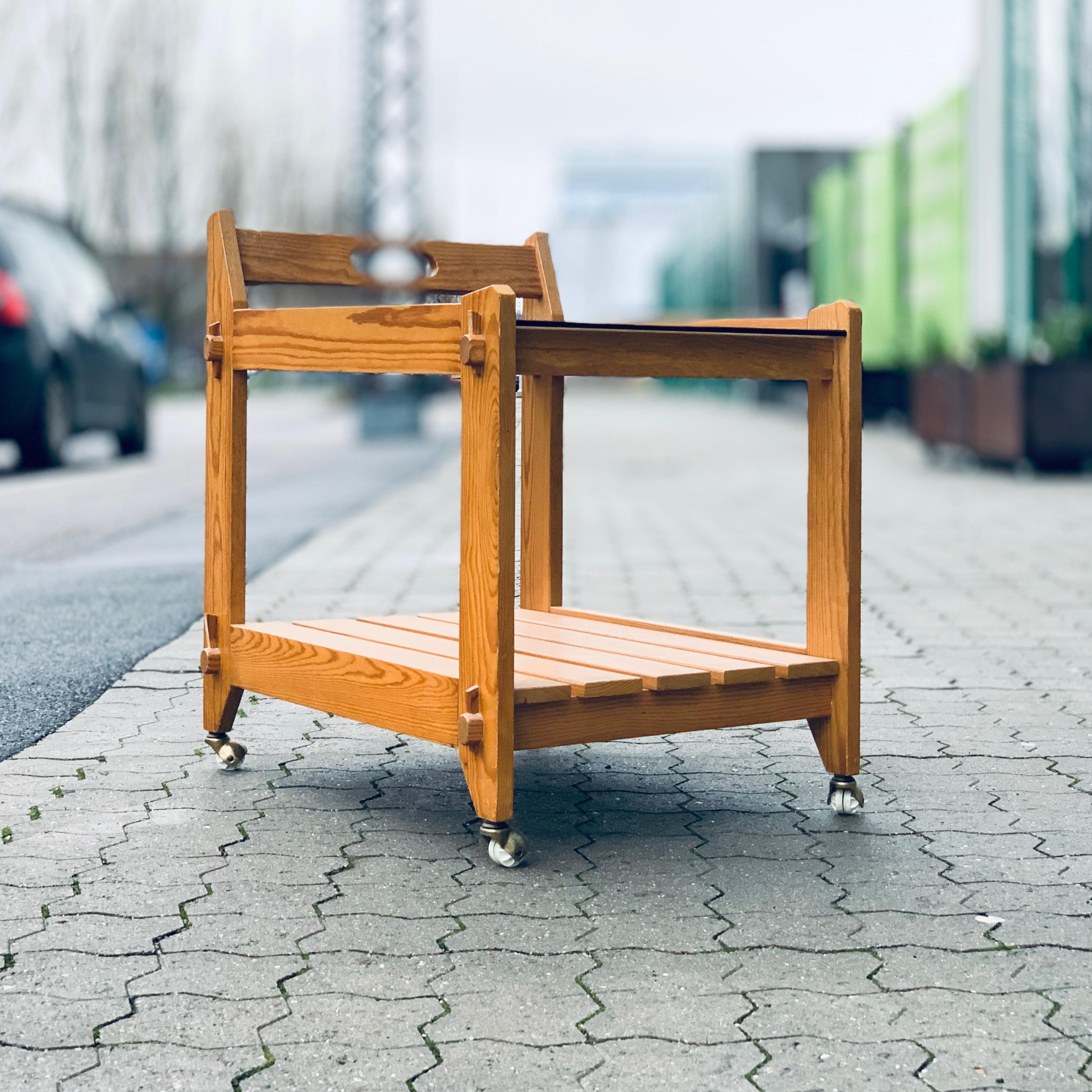 Funky Ikea vintage trolley from the 1970s made of pine wood and smoked glass, stands on castors

Great vintage condition, a rare vintage piece.

        