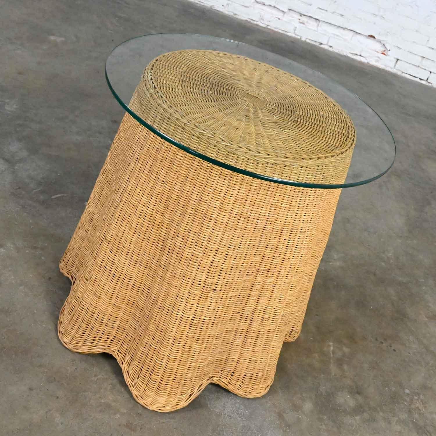 Fabulous vintage Trompe L’oeil draped natural wicker end or side table with 3/8-inch round glass top. Beautiful condition, keeping in mind that this is vintage and not new so will have signs of use and wear. Note that we have added and internal wood