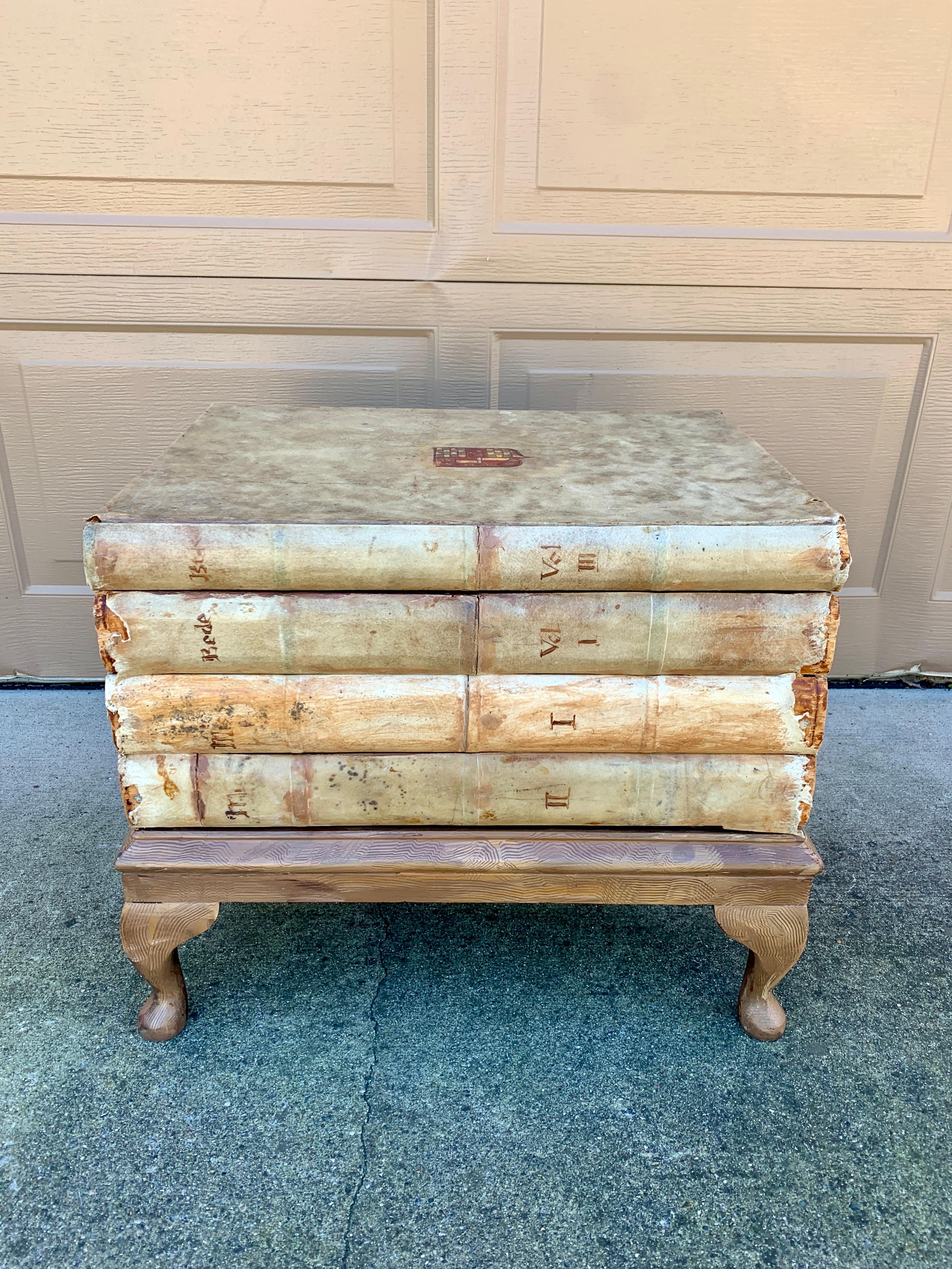 A gorgeous trompe l'oeil faux stack of books side table with storage

USA, Circa 1980s

Measures: 23.25