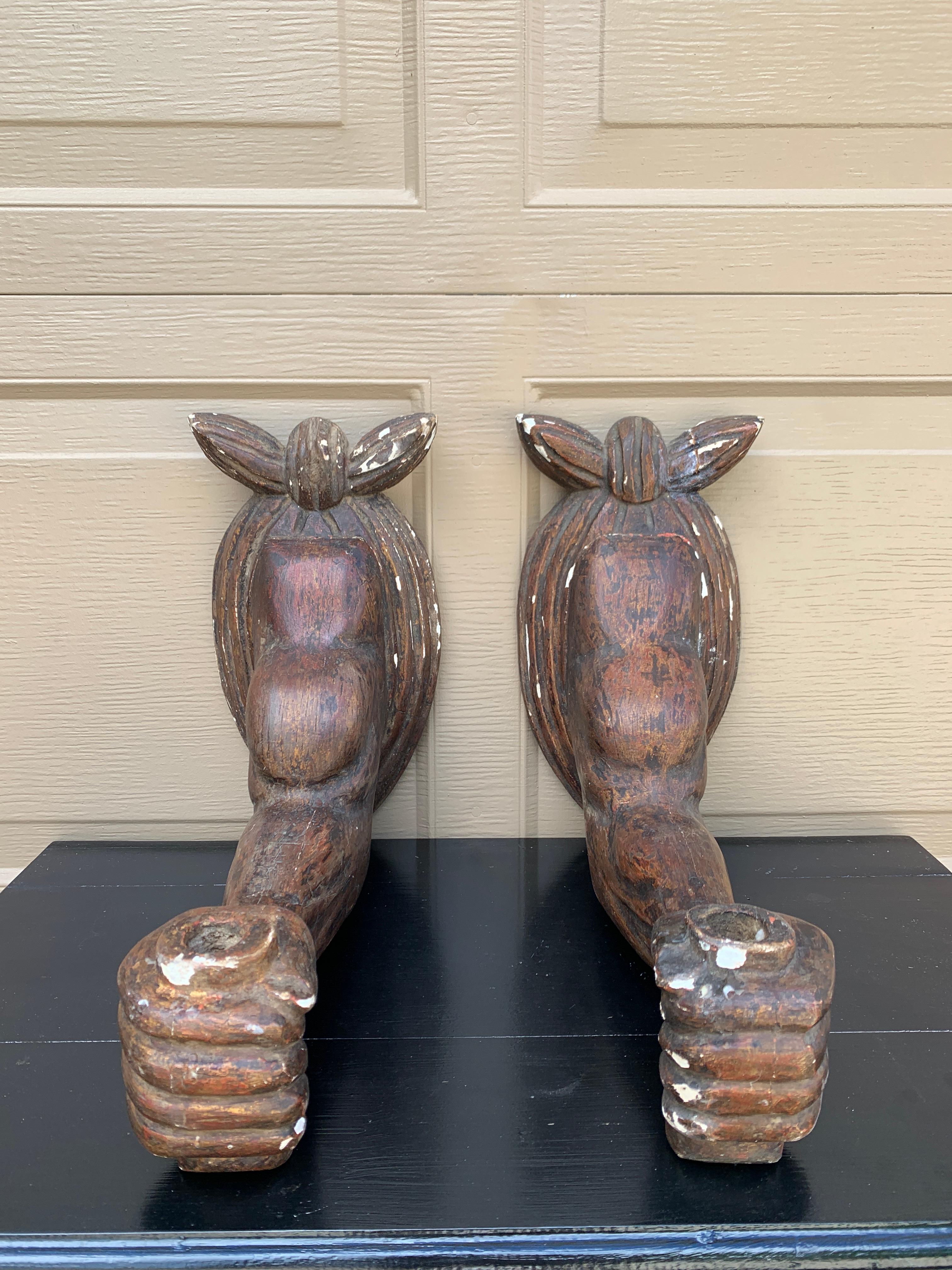 A unique and beautiful pair of Neoclassical style painted trompe l'oeil plaster and composition candle wall sconces in the form of arms

USA, Mid-20th Century

Each measures: 6.75
