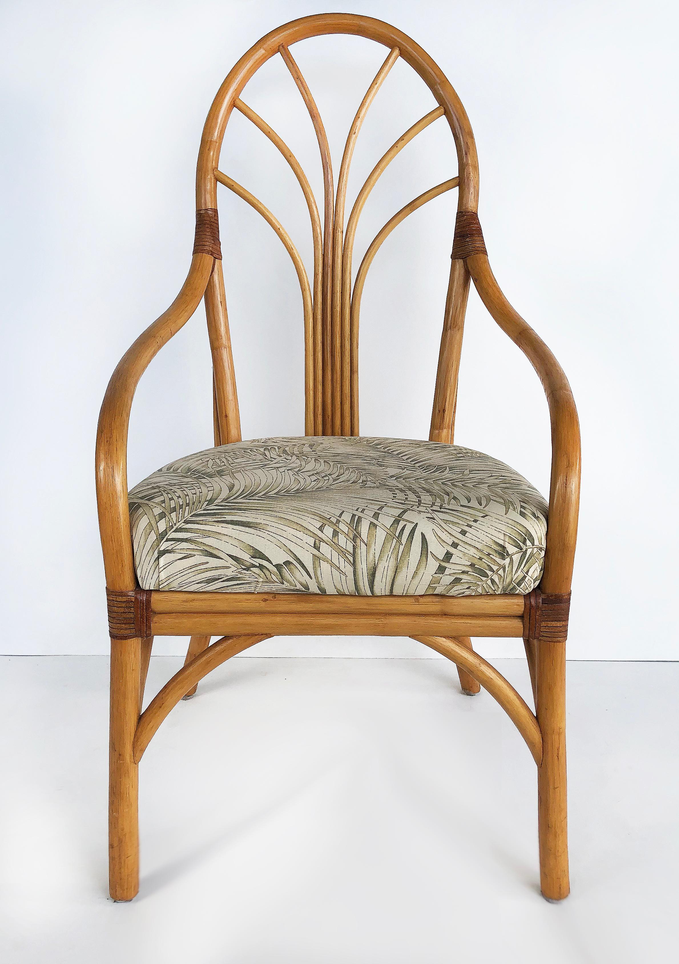 Vintage tropical bent rattan dining chairs, set of four

Offered for sale is a set of four bent rattan dining chairs with upholstered seats. The fabric and style of the chairs is tropical or coastal in style and all four of the chairs are armchairs.