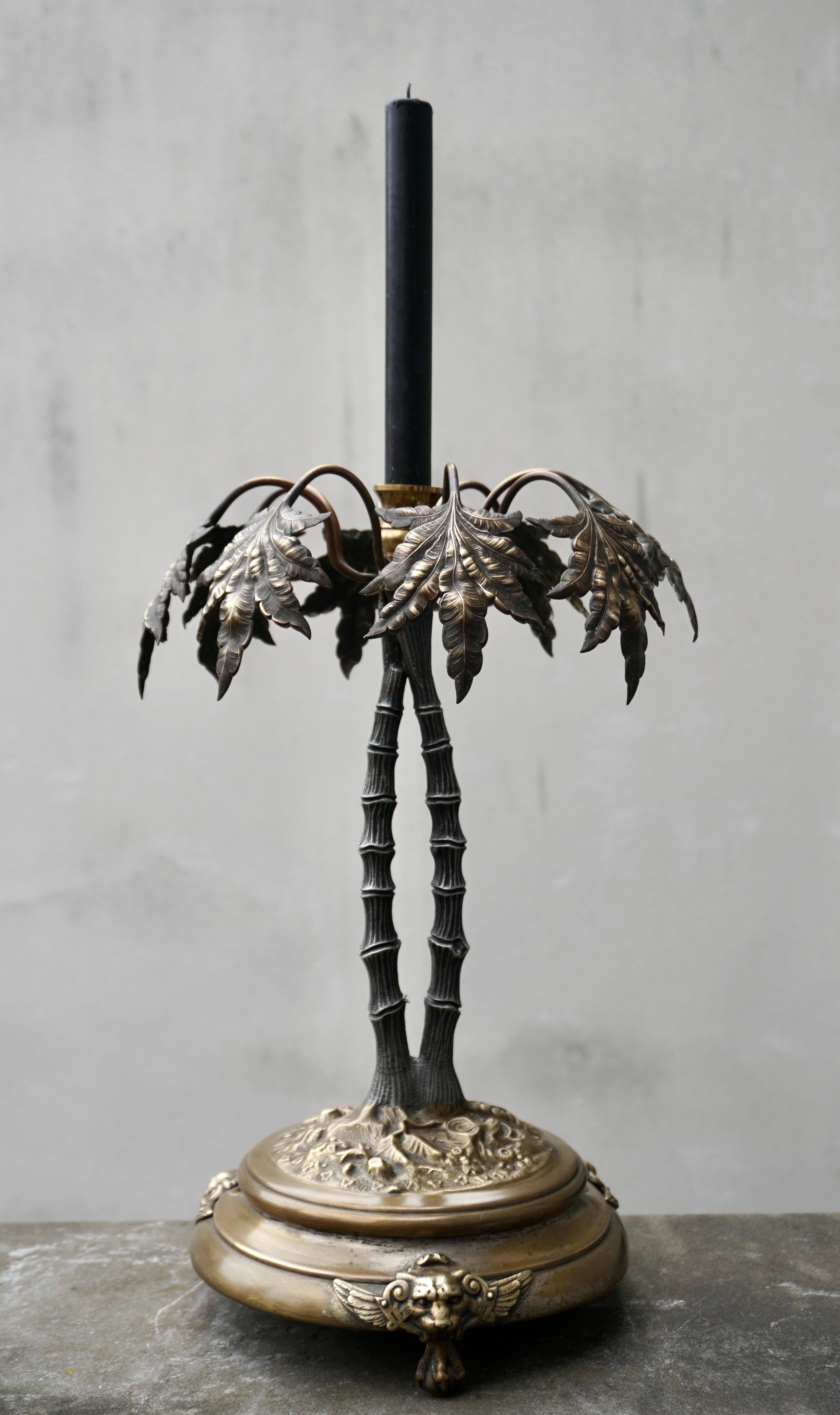 Lovely vintage brass palm tree leaf leaves candle stick holder with lion heads and claw paws. 
Original brass patina. 

Dimensions: 16