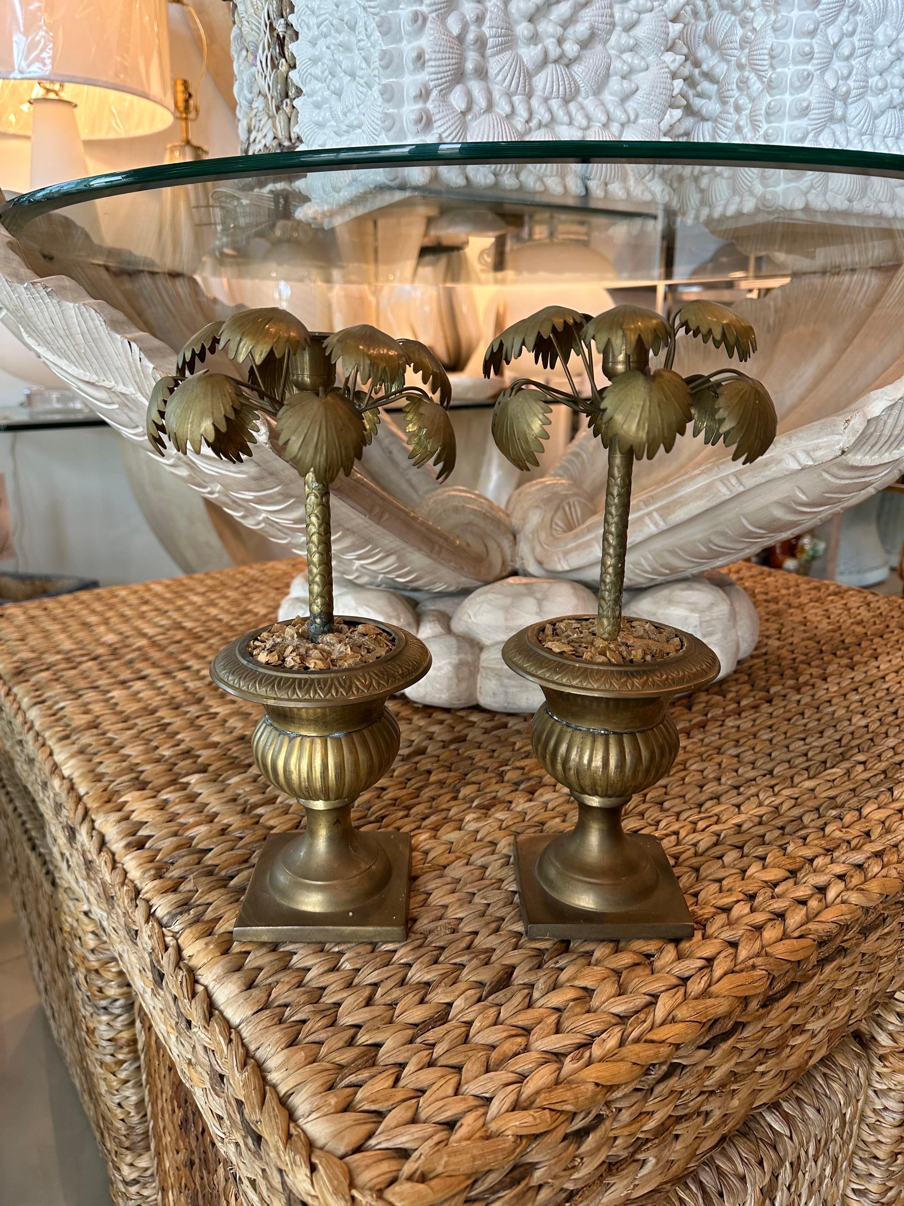 Lovely vintage pair of brass urn palm tree leaf leaves candle stick holders. Original brass patina. Dimensions: 12 H x 6 D.