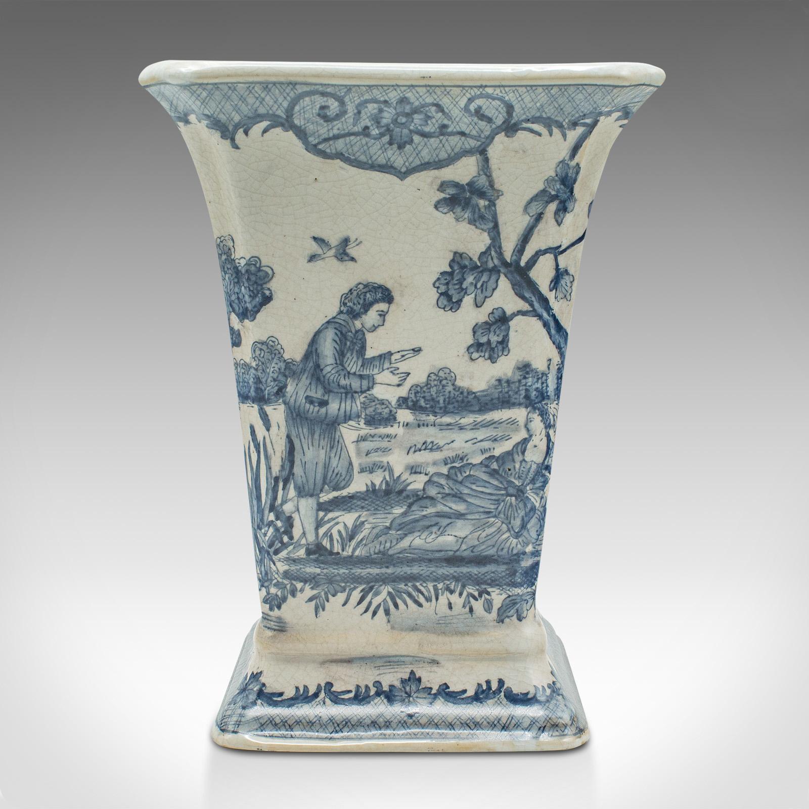 This is a vintage trumpet vase. A Chinese, ceramic flower sleeve in European romantic taste, dating to the late 20th century, circa 1980.

Appealing 18th century European decor to this charming vase
Displays a desirable aged patina and in good