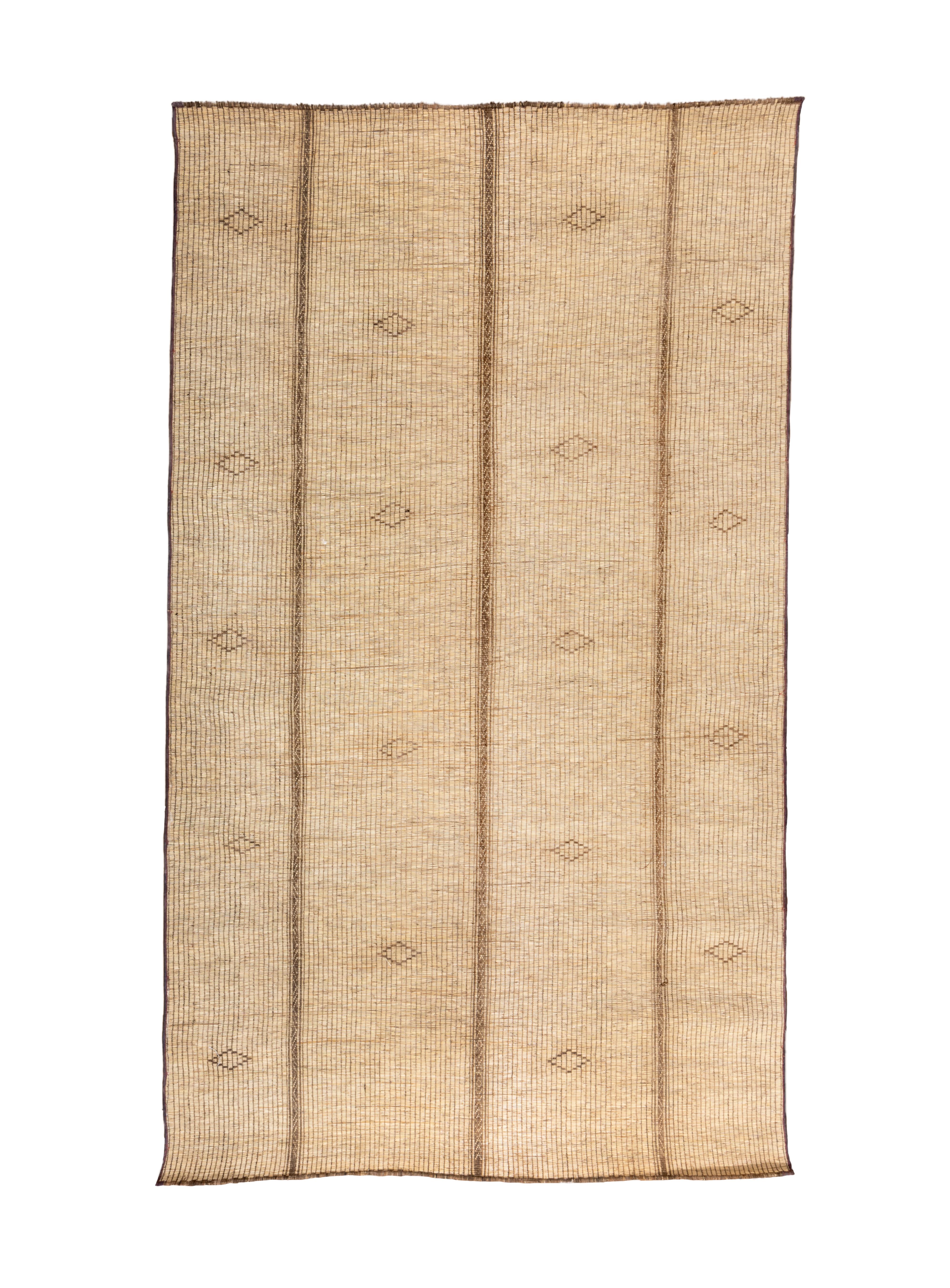One advantage of reed rugs is that they can be rolled up easily and are lightweight, hence perfect to nomadic tribesfolk. Here the creamy beige reedwork field is vertically divided into two wide and two narrower panels, all with simple small open
