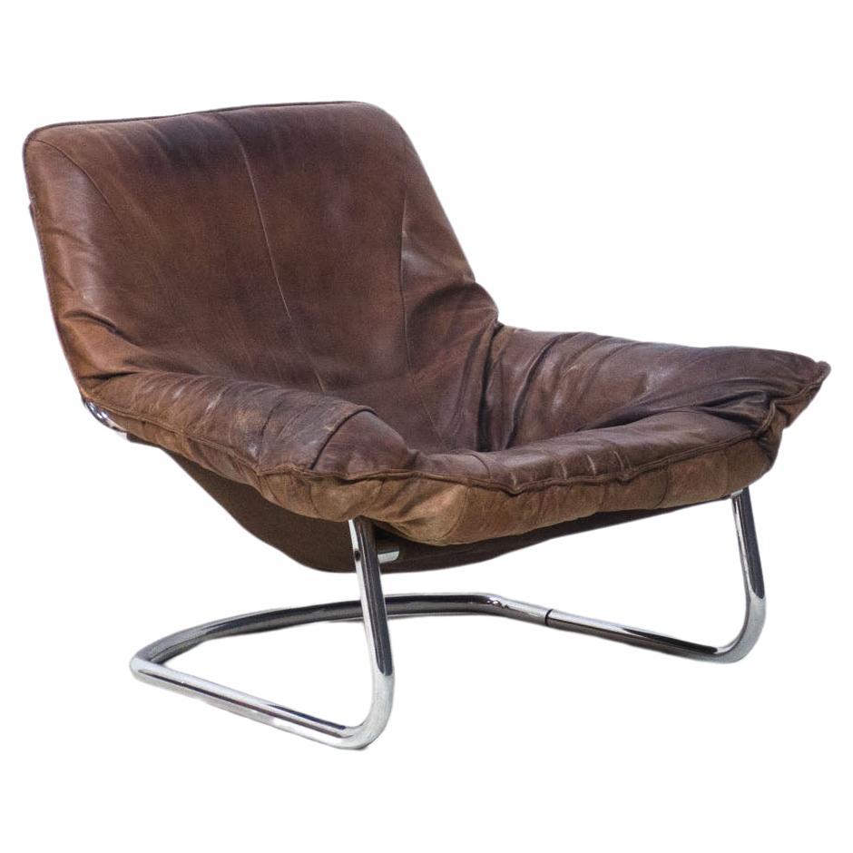 Vintage tube steel and leather lounge chair For Sale