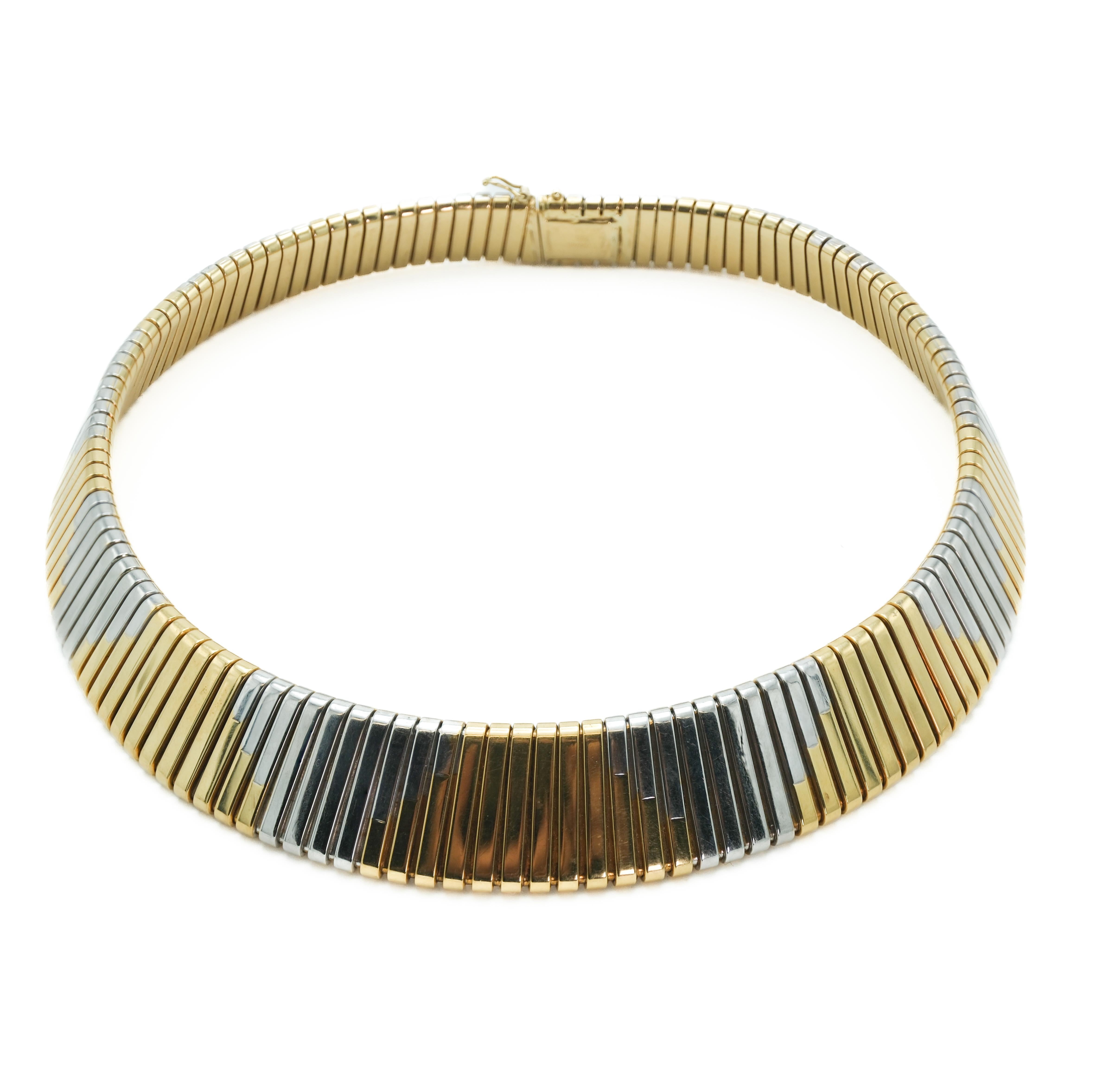 Fused together in the distinctive tubogas design, this rare two-tone Bvlgari choker is composed of 18-karat white and yellow gold. Resting comfortably against the collar bone, the necklace illustrates an engaging mix of warm and cool tones. Its