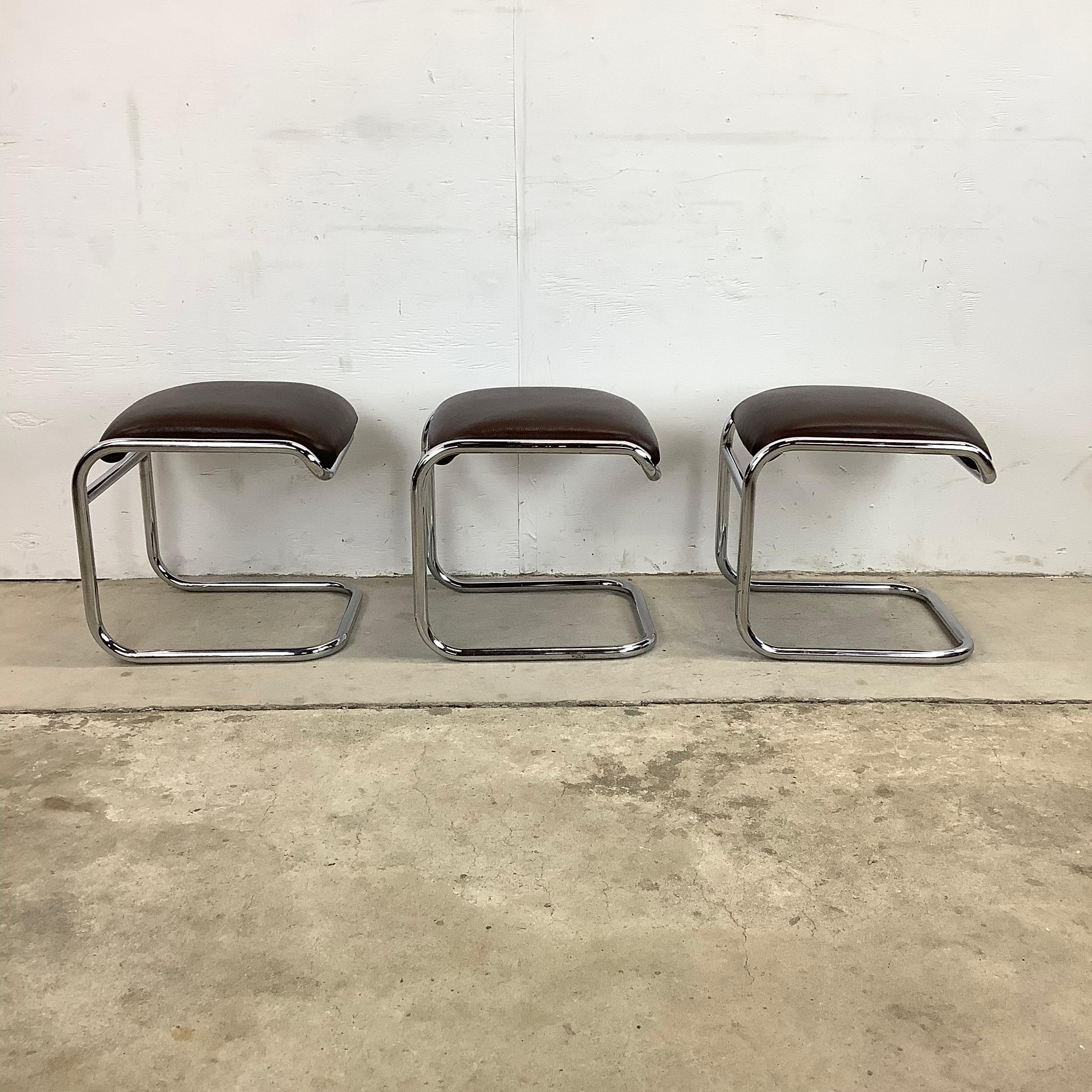 The elegant bauhaus style of this matching set of three vintage modern low stools features the iconic cantilever design of Anton Lorenz from Thonet makes a simple yet stunning addition to any interior in need of additional seating. Impressive