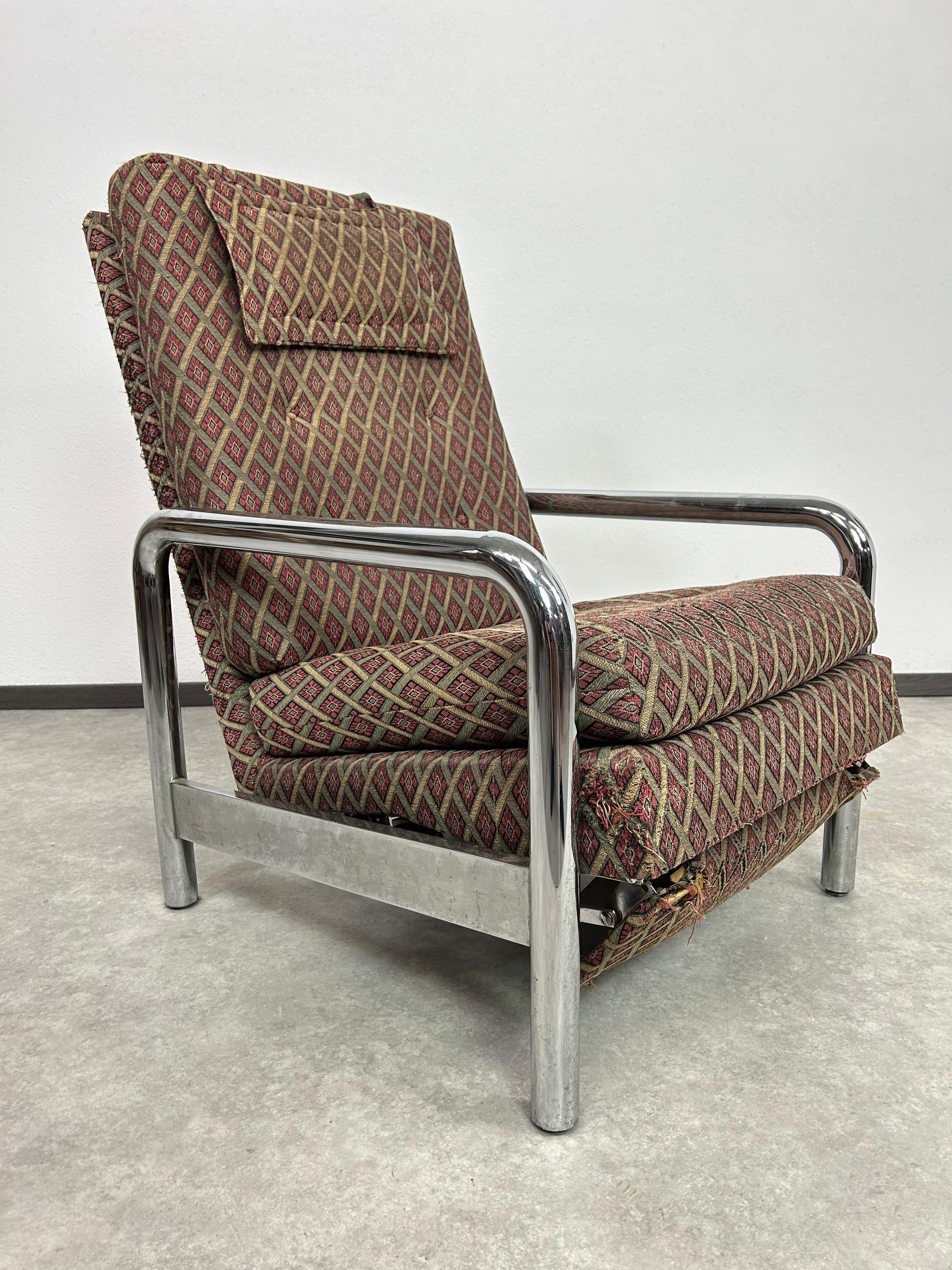 Vintage Tubular Chrome Recliner by Milo Baughman in original vintage condition with signs of use. We provide our clients with professional restoration and upholstery services.
